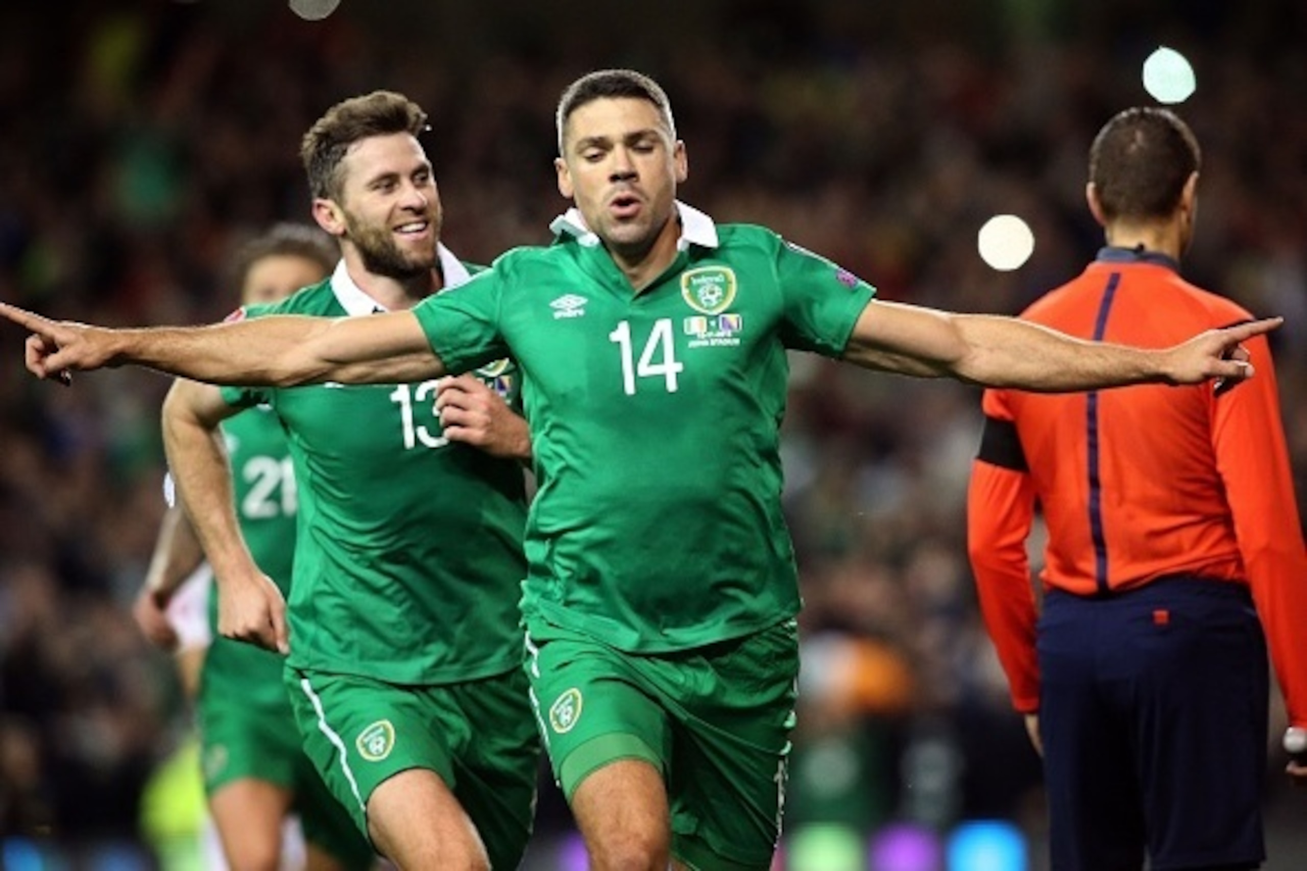 Ireland's striker Jonathan Walters (C) celebrates after scoring his team's first goal from a penalty during a UEFA Euro 2016 Group D qualifying second leg play-off football match between Ireland and Bosnia Herzegovina at the Aviva stadium in Dublin on Nov