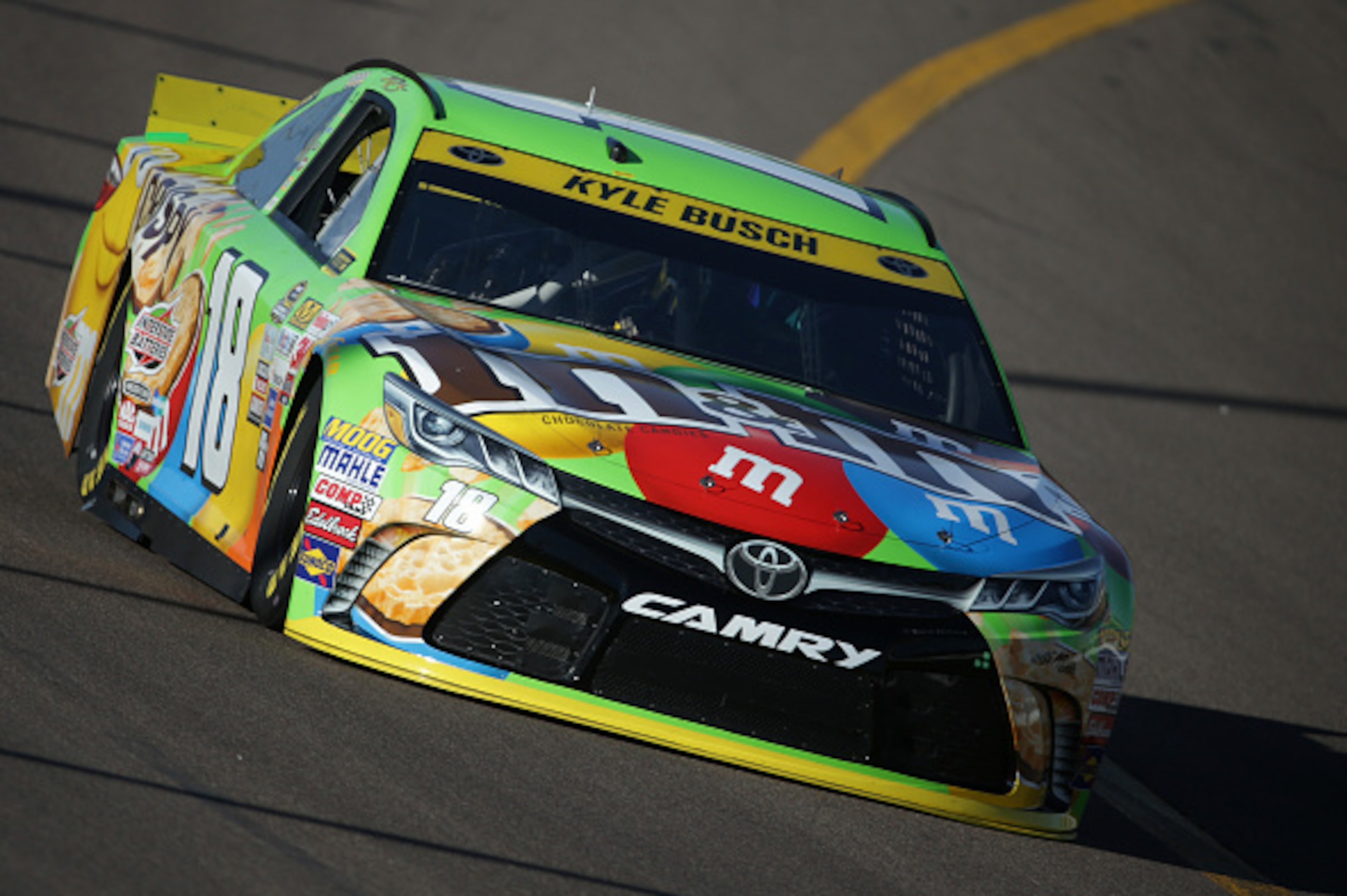 AVONDALE, AZ - NOVEMBER 14:  Kyle Busch, driver of the #18 M&M's Crispy Toyota, drives during practice for the NASCAR Sprint Cup Series Quicken Loans Race for Heroes 500 at Phoenix International Raceway on November 14, 2015 in Avondale, Arizona.  (Photo b