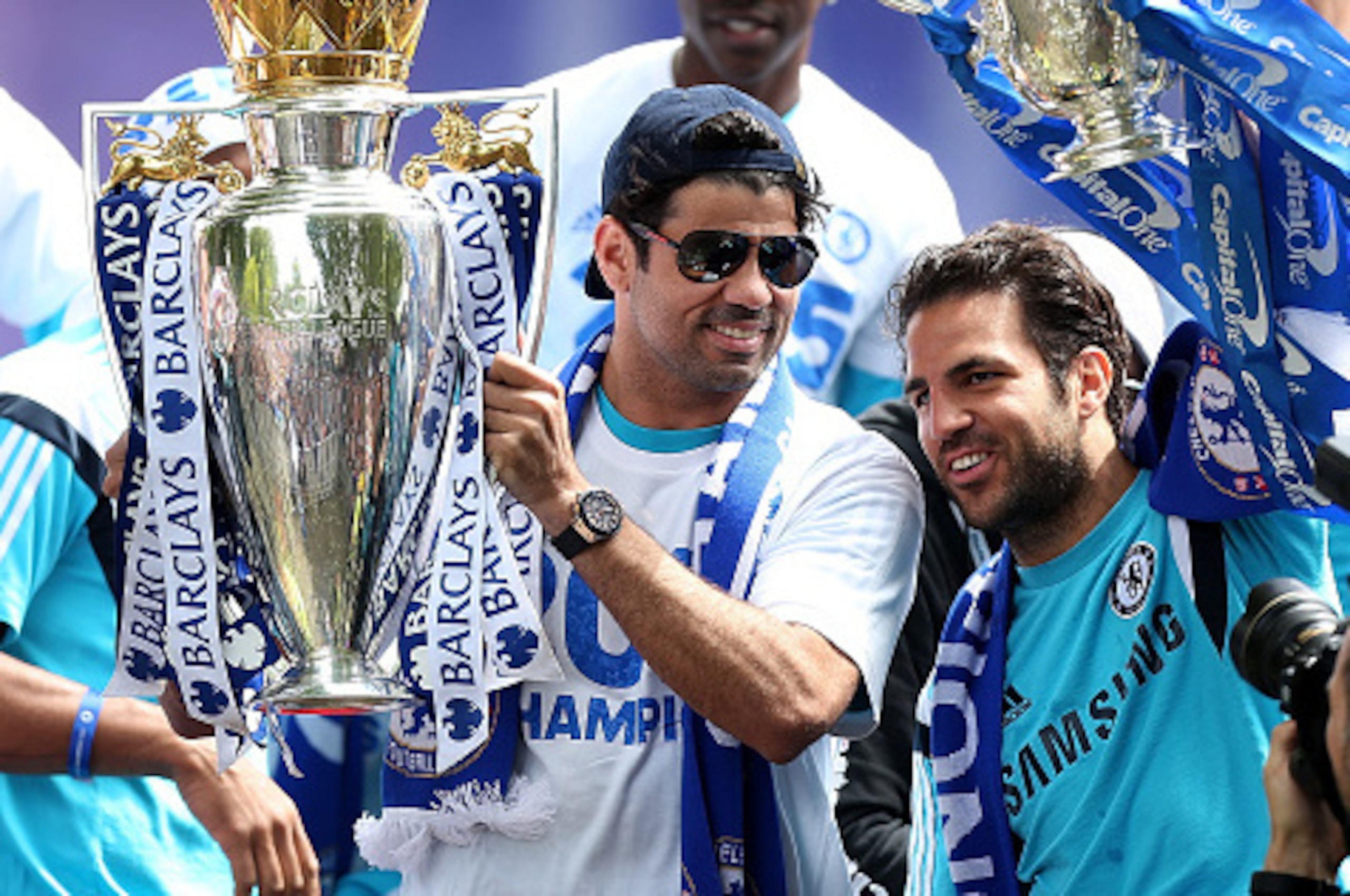 LONDON, ENGLAND - MAY 25: Diego Costa (L) and Cesc Fabregas (R) of Chelsea celebrate with the Premier League and Capital One Cup trophies duing the Chelsea FC Premier League Victory Parade on May 25, 2015 in London, England. (Photo by Ben Hoskins/Getty LONDON, ENGLAND - MAY 25: Diego Costa (L) and Cesc Fabregas (R) of Chelsea celebrate with the Premier League and Capital One Cup trophies duing the Chelsea FC Premier League Victory Parade on May 25, 2015 in London, England. (Photo by Ben Hoskins/Getty