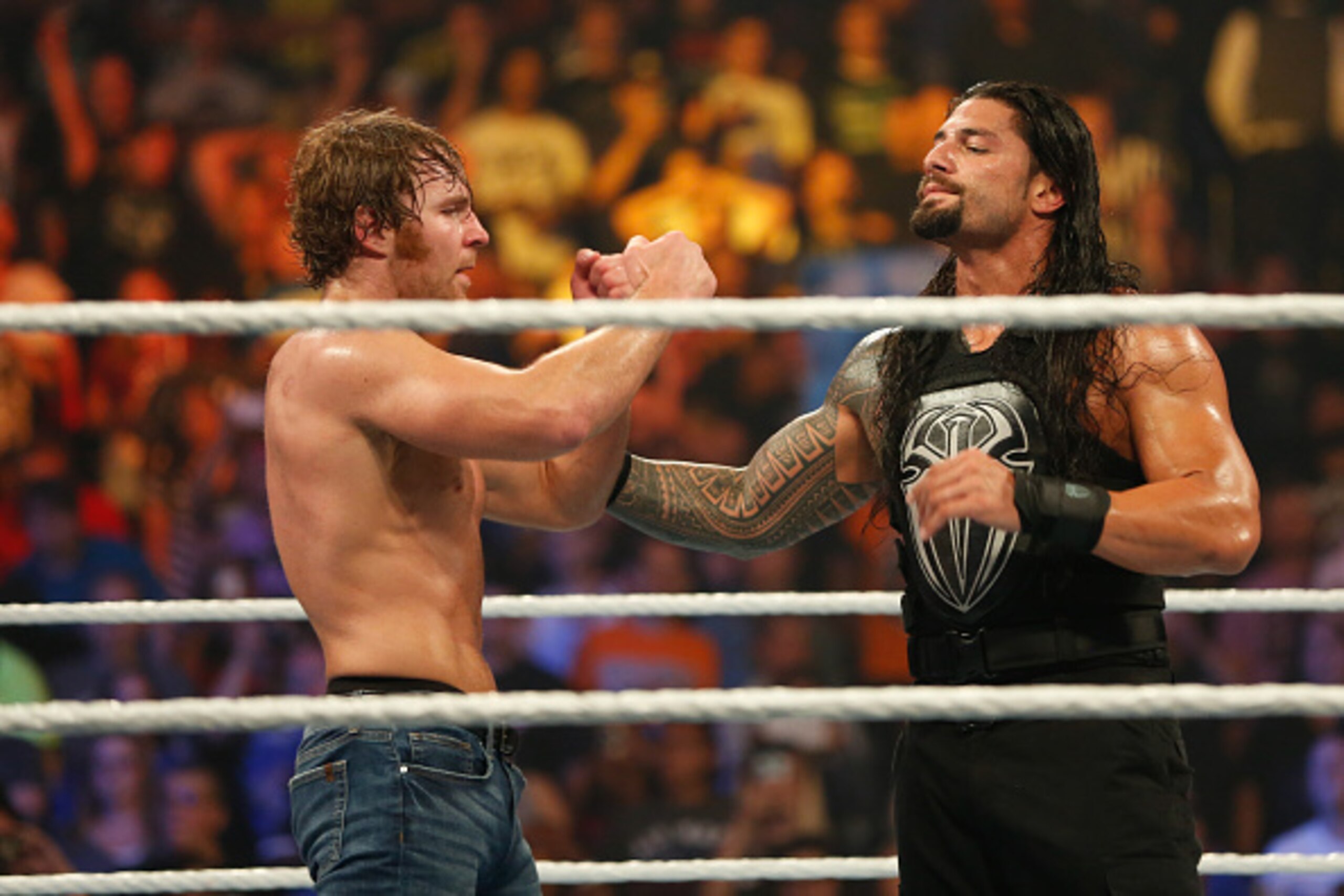 NEW YORK, NY - AUGUST 23:  Dean Ambrose and Roman Reigns celebrate their victory at the WWE SummerSlam 2015 at Barclays Center of Brooklyn on August 23, 2015 in New York City.  (Photo by JP Yim/Getty Images)