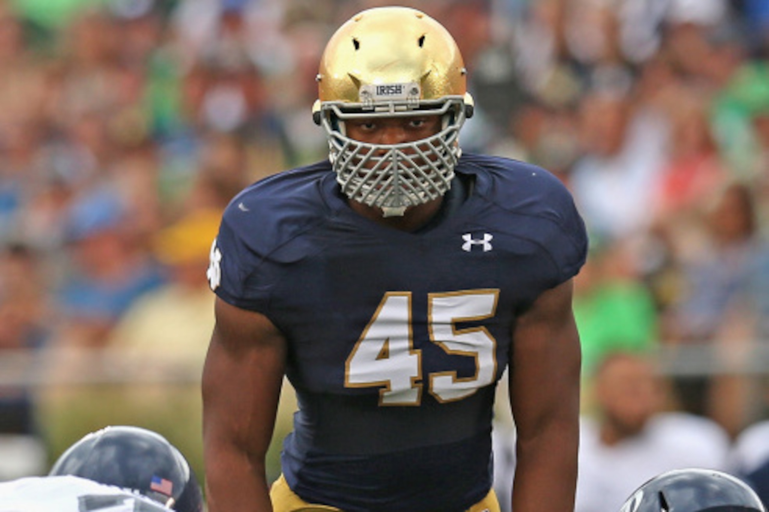 SOUTH BEND, IN - AUGUST 30: Romeo Okwara #45 of the Norte Dame Fighting Irish awaits the snap against the Rice Owls at Notre Dame Stadium on August 30, 2014 in South Bend, Indiana. Notre Dame defeated Rice 48-17.  (Photo by Jonathan Daniel/Getty Images)