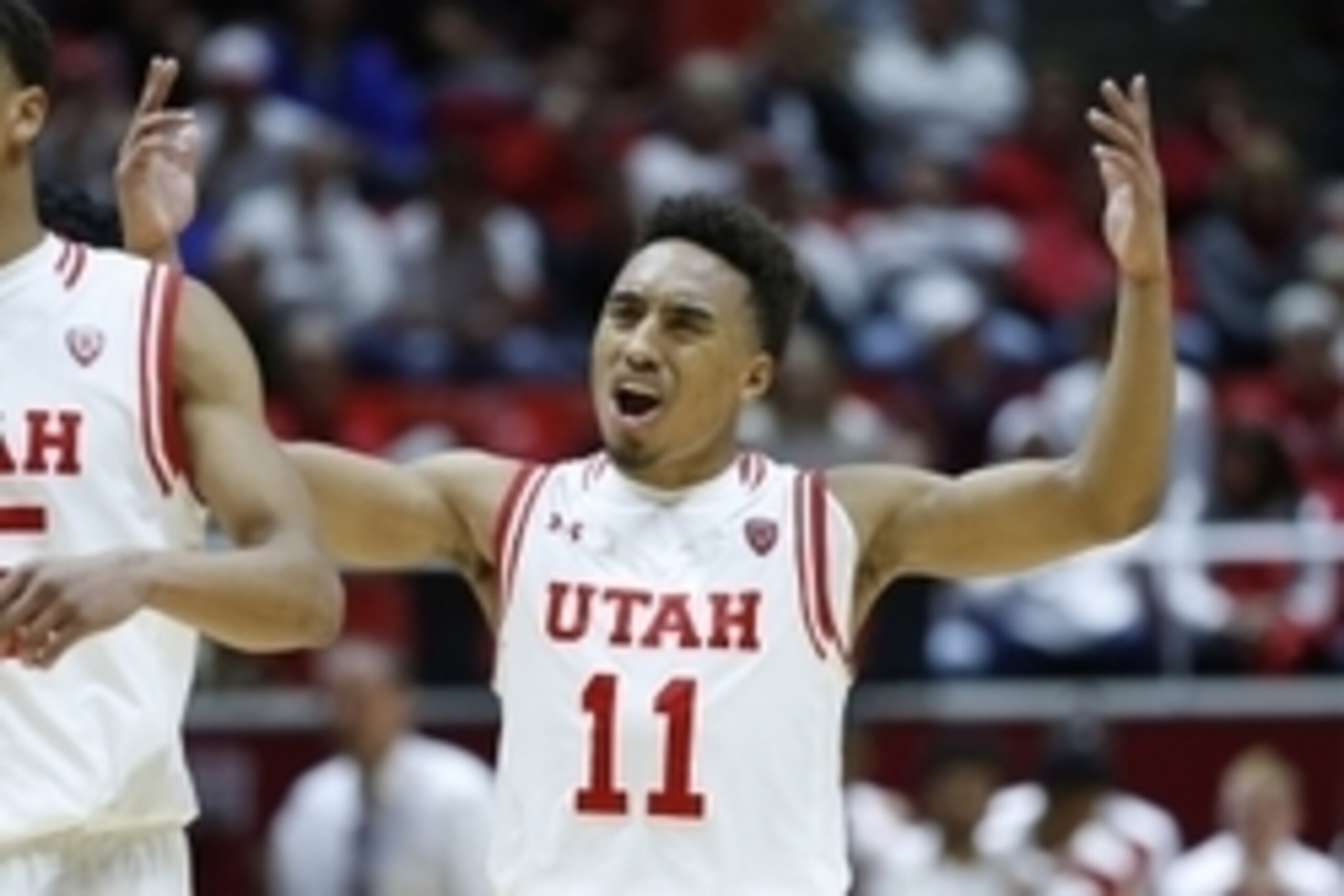 Nov 16, 2015; Salt Lake City, UT, USA;  Utah Utes guard Brandon Taylor (11) interacts with fans late in the second half against the San Diego State Aztecs at Jon M. Huntsman Center. Utah won 81-76. Mandatory Credit: Jeff Swinger-USA TODAY Sports