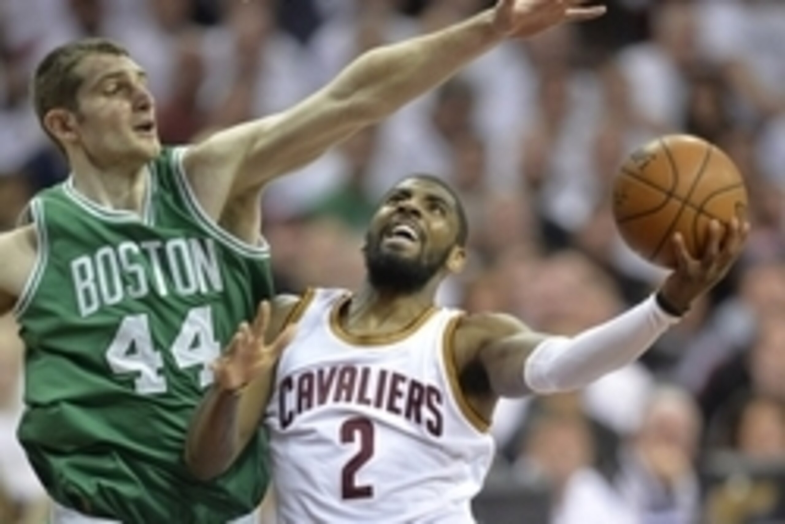 Apr 21, 2015; Cleveland, OH, USA; Cleveland Cavaliers guard Kyrie Irving (2) drives against Boston Celtics center Tyler Zeller (44) in the fourth quarter in game two of the first round of the NBA Playoffs at Quicken Loans Arena. Mandatory Credit: David Ri