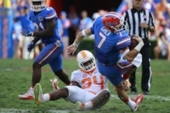 Sep 26, 2015; Gainesville, FL, USA; Tennessee Volunteers linebacker Darrin Kirkland Jr. (34) tackles Florida Gators quarterback Will Grier (7) during the first half at Ben Hill Griffin Stadium. Mandatory Credit: Kim Klement-USA TODAY Sports