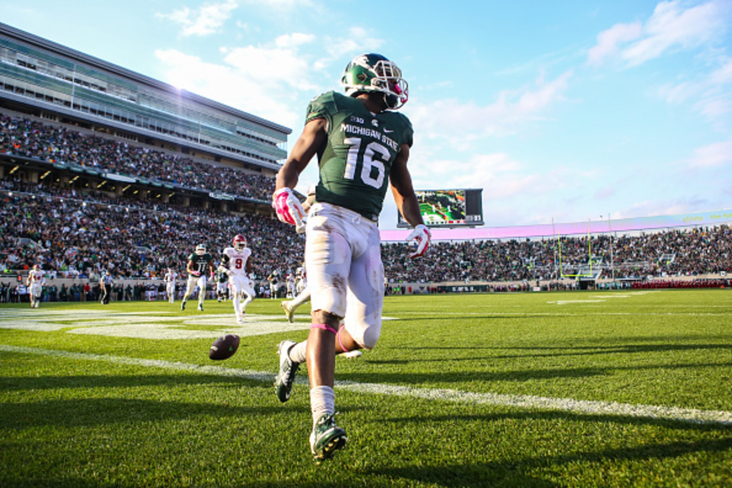 EAST LANSING, MI - OCTOBER 24: Aaron Burbridge #16 of the Michigan State Spartans celebrates his touchdown in the third quarter against the Indiana Hoosiers at Spartan Stadium on October 24, 2015 in East Lansing, Michigan. (Photo by Rey Del Rio/Getty Imag