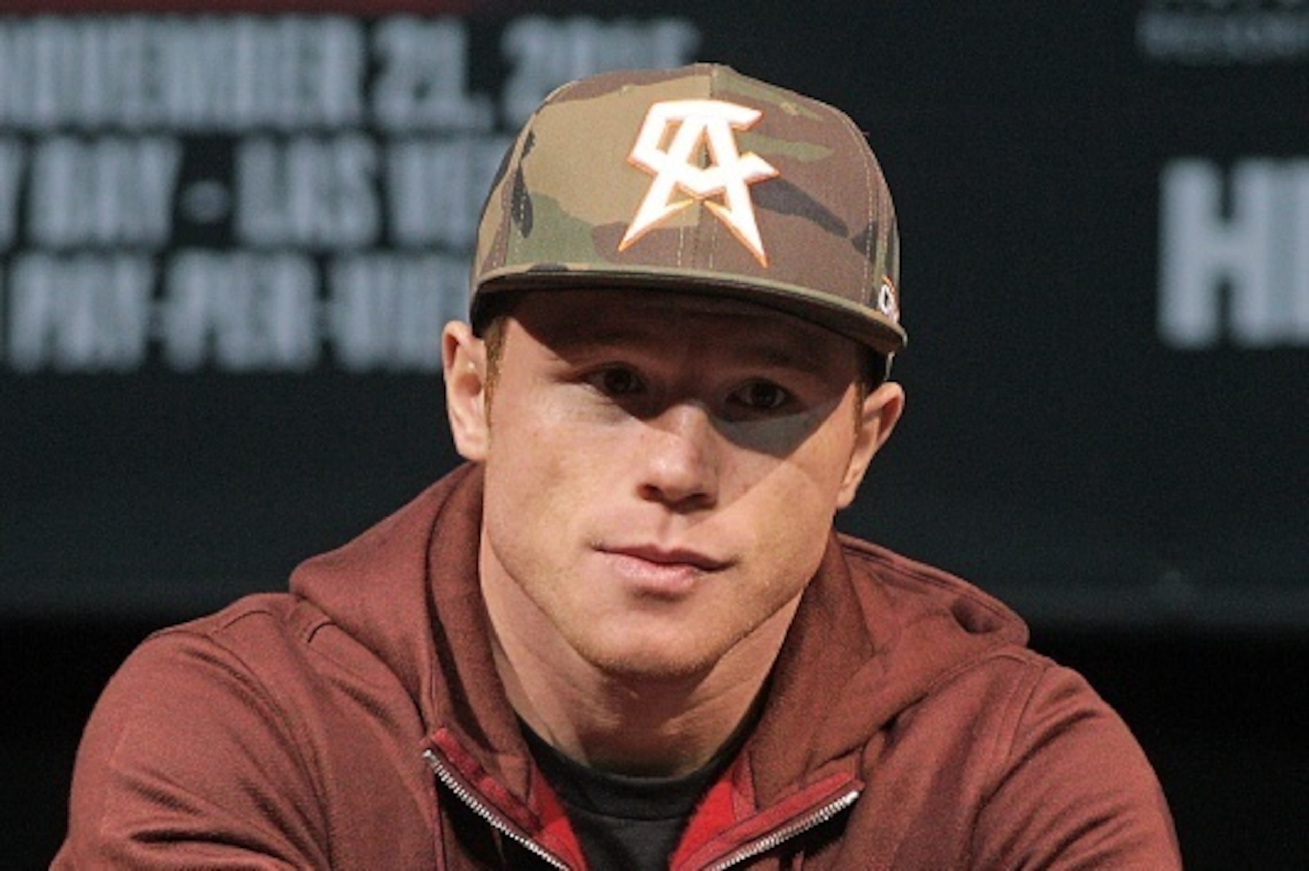 Two time world champion, Saul 'Canelo' Alvarez from Guadalajara, Mexico looks on as former WBC Middleweight World Champion Miguel Cotto, from Puerto Rico speaks during a press conference in Las Vegas, Nevada on November 18, 2015. Cotto was stripped of hi Two time world champion, Saul 'Canelo' Alvarez from Guadalajara, Mexico looks on as former WBC Middleweight World Champion Miguel Cotto, from Puerto Rico speaks during a press conference in Las Vegas, Nevada on November 18, 2015. Cotto was stripped of hi