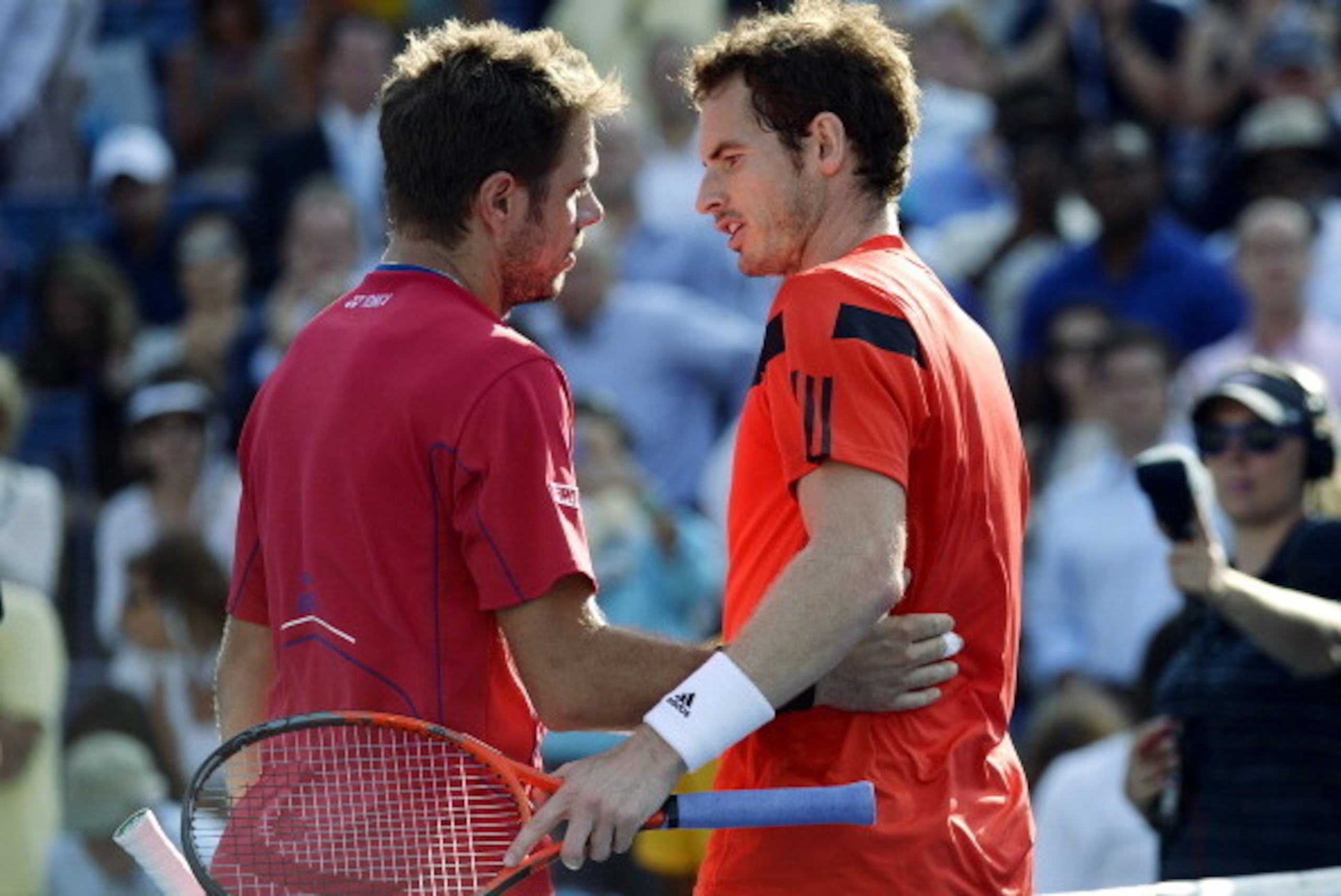 Stanislas Wawrinka of Switzerland (L) greets Andy Murray of Great Britian at the end of their 2013 US Open men's singles quarterfinal match at the USTA Billie Jean King National Tennis Center in New York on September 5, 2013. Wawrinka won 6-4, 6-3, 6-2   