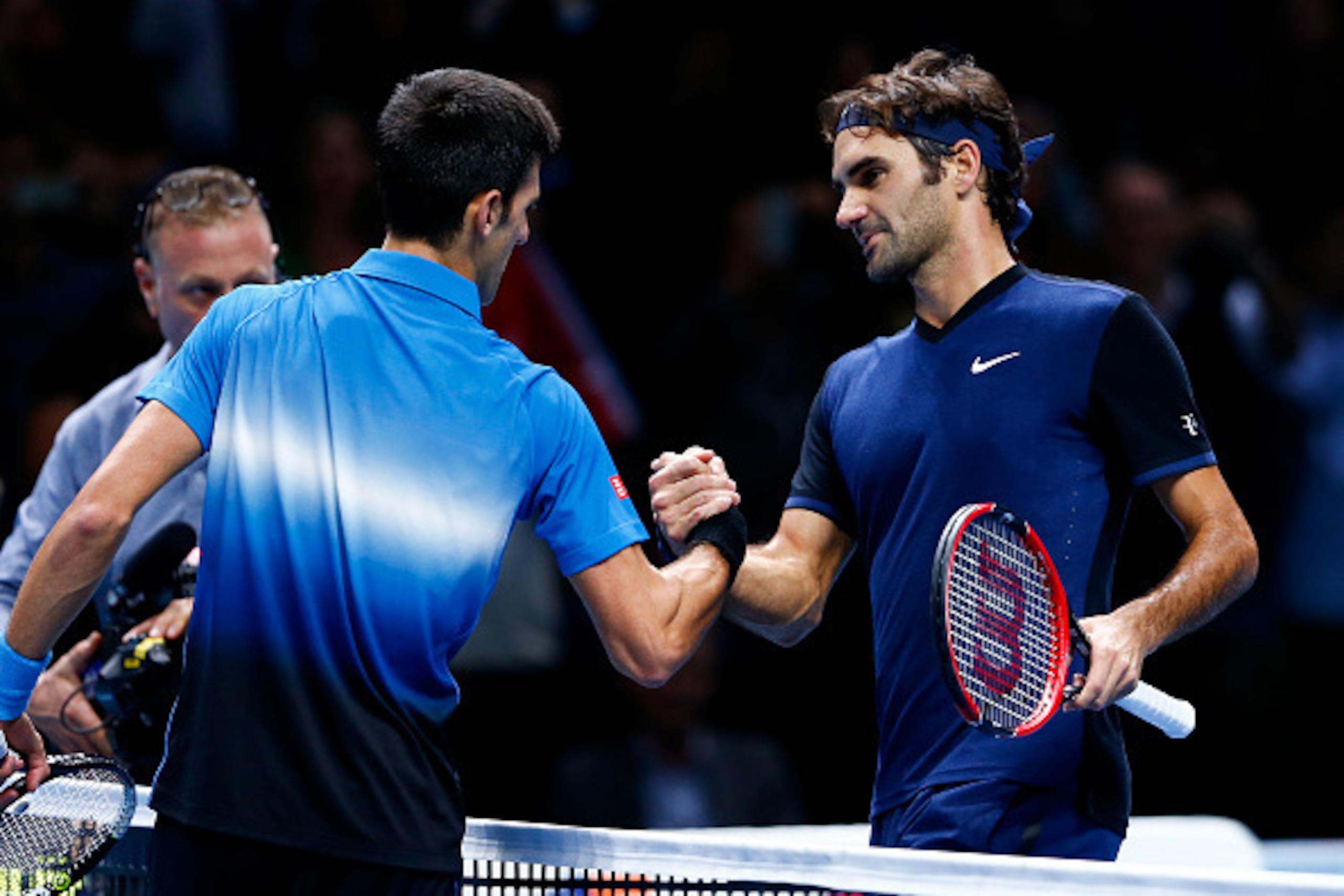 LONDON, ENGLAND - NOVEMBER 17:  Roger Federer of Switzerland (R) shakes hands with Novak Djokovic of Serbia (L) after his straight sets victory during day three of the Barclays ATP World Tour Finals at the O2 Arena on November 17, 2015 in London, England.