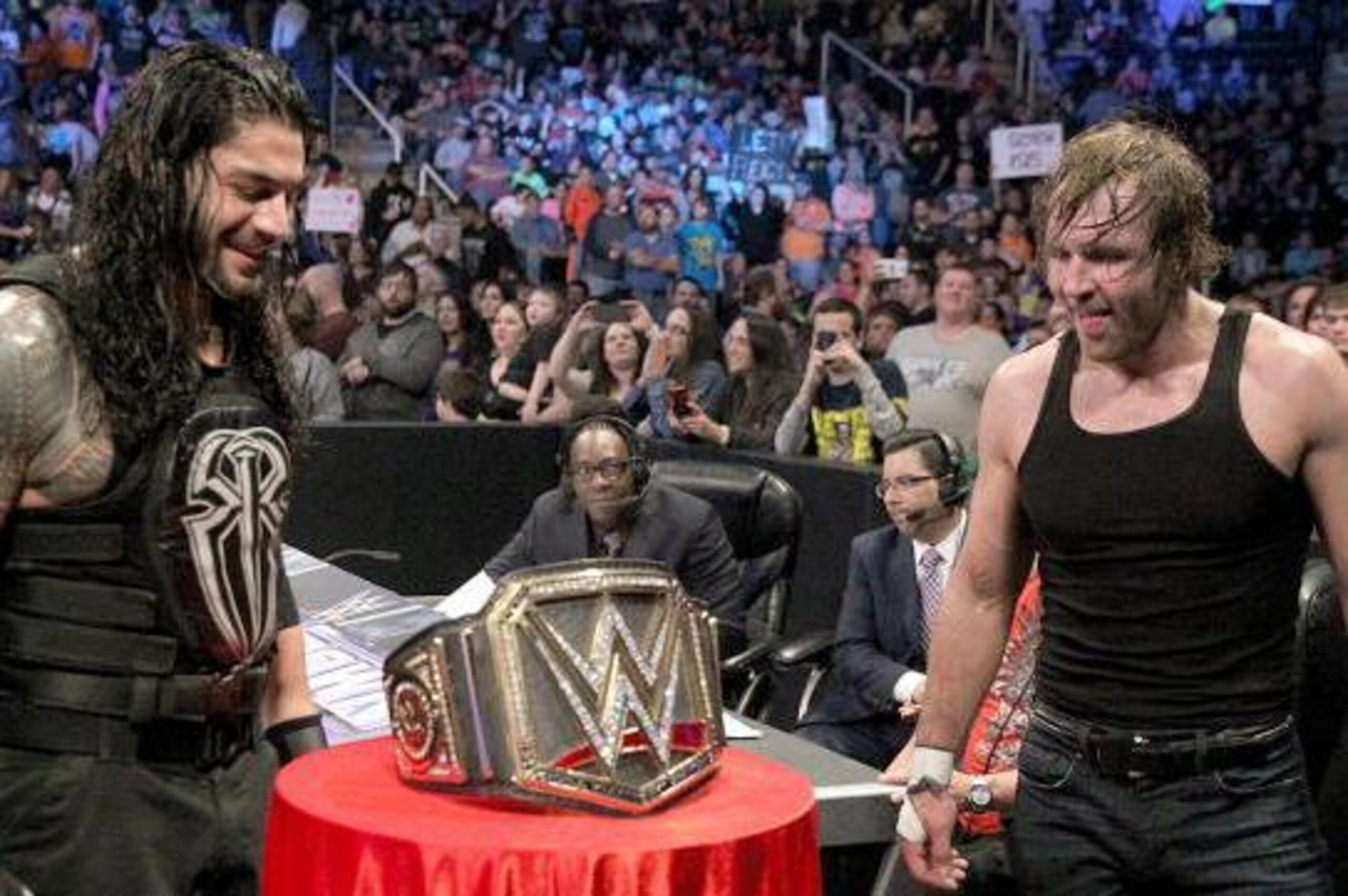 Roman Reigns and Dean Ambrose desire the WWE World Heavyweight Championship. Roman Reigns and Dean Ambrose desire the WWE World Heavyweight Championship.
