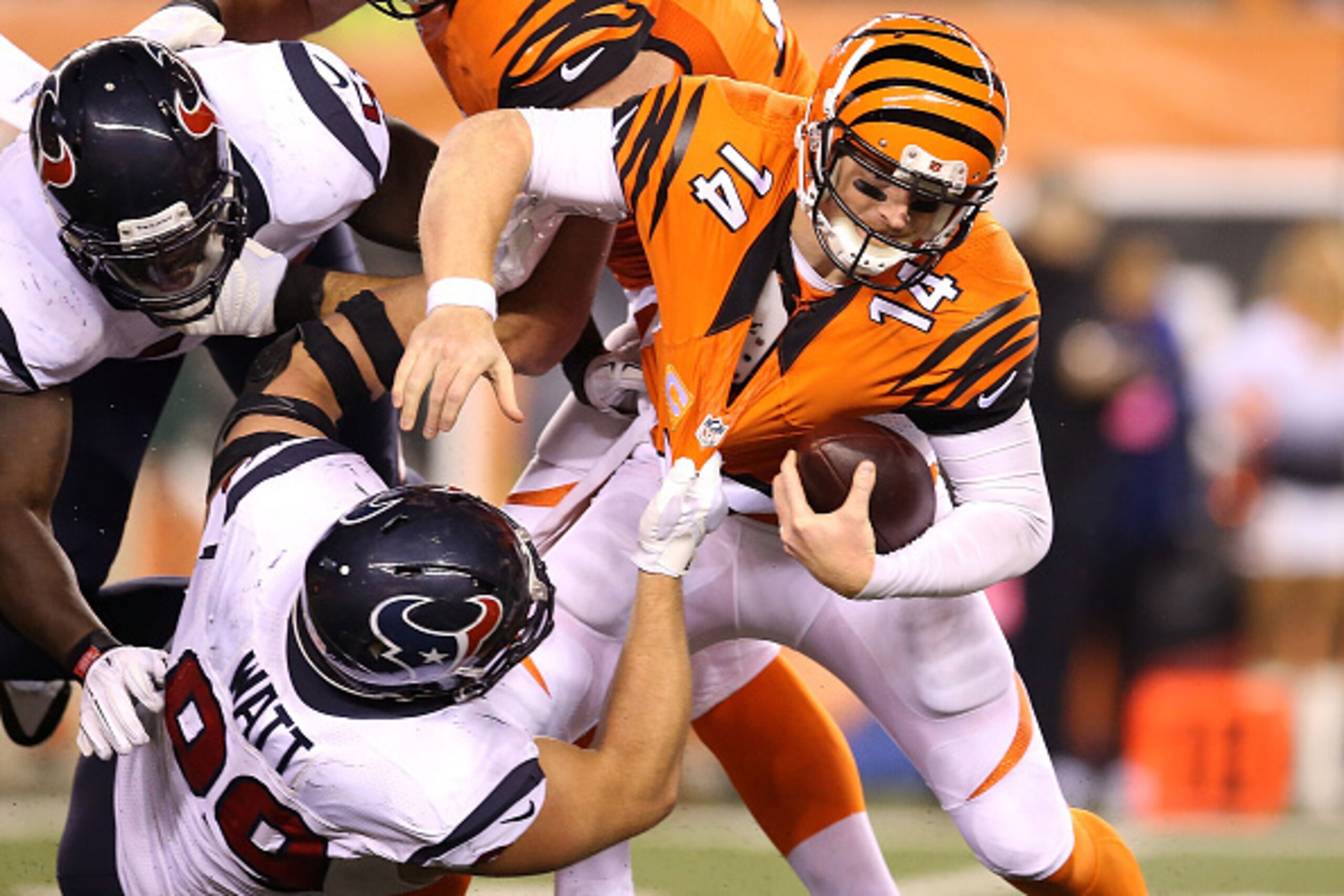 CINCINNATI, OH - NOVEMBER 16:  J.J. Watt #99 of the Houston Texans sacks Andy Dalton #14 of the Cincinnati Bengals during the fourth quarter at Paul Brown Stadium on November 16, 2015 in Cincinnati, Ohio. Houston defeated Cincinnati 10-6. (Photo by Andy L