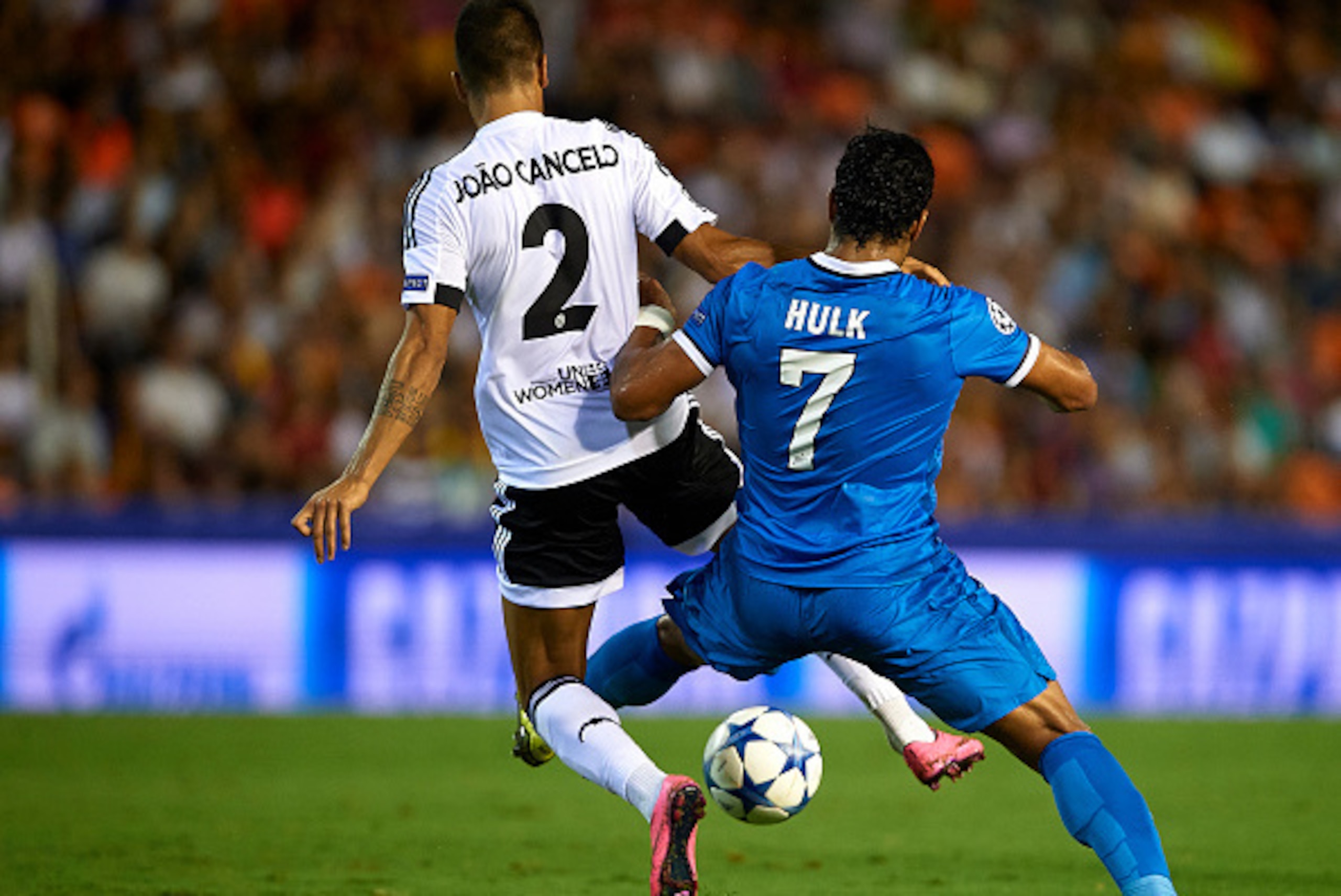 VALENCIA, SPAIN - SEPTEMBER 16: Joao Cancelo of Valencia competes for the ball with Hulk (R) of Zenit during the UEFA Champions League Group H match between Valencia CF and FC Zenit at the Estadi de Mestalla on September 16, 2015 in Valencia, Spain.  (Pho