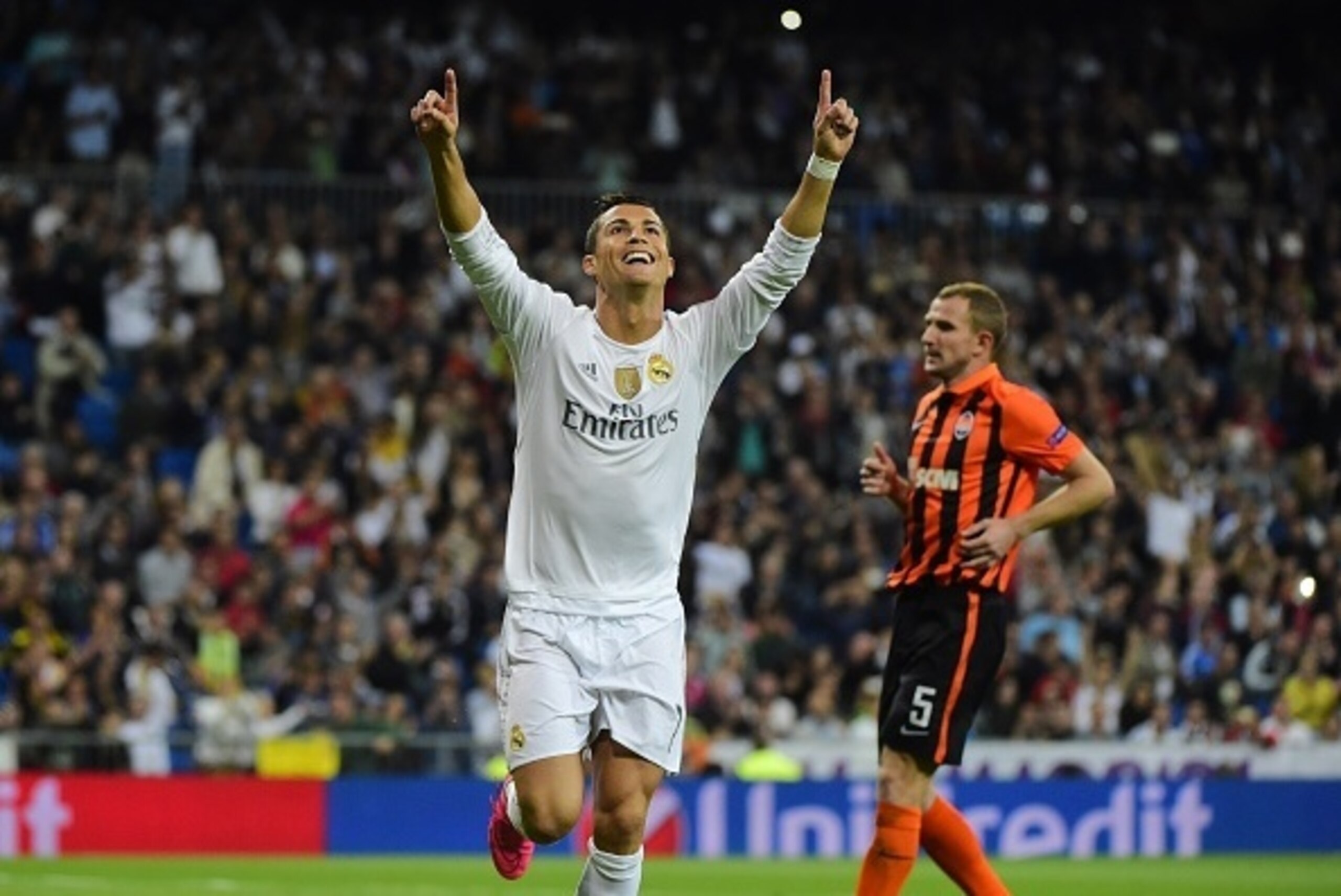 Real Madrid's Portuguese forward Cristiano Ronaldo celebrates his second goal during the UEFA Champions League group A football match Real Madrid CF vs FC Shakhtar Donetsk at the Santiago Bernabeu stadium in Madrid on September 15, 2015. AFP PHOTO/ PIERRE