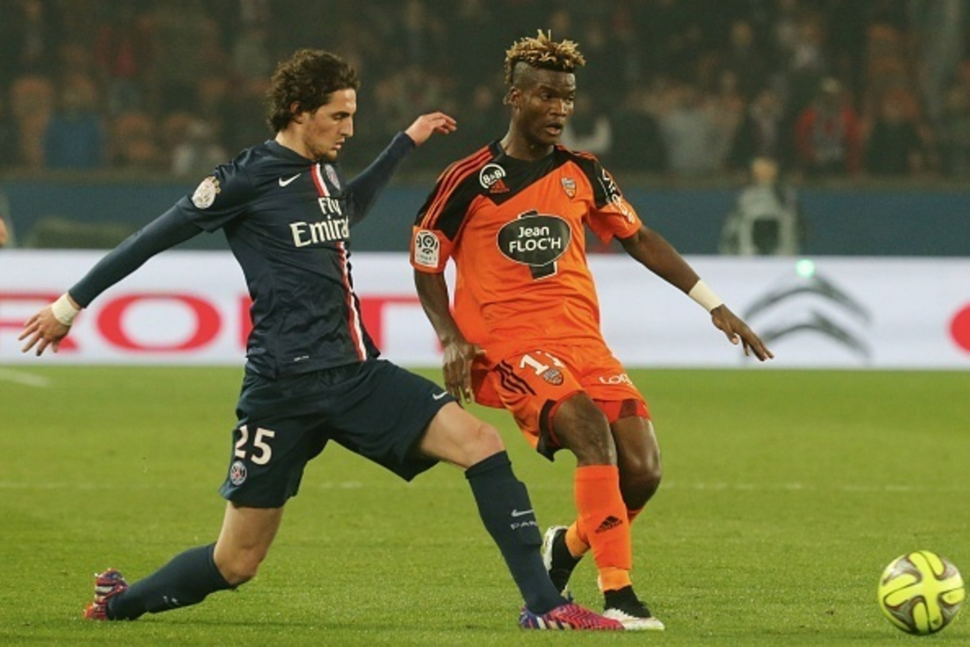 PARIS, FRANCE - MARCH 20:  Adrien Rabiot  of Paris Saint-Germain and Didier Ibrahim Ndong of FC Lorient during the French  Ligue 1 between Paris Saint-Germain FC and FC Lorient at Parc Des Princes on march 20, 2015 in Paris, France.  (Photo by Xavier Lain