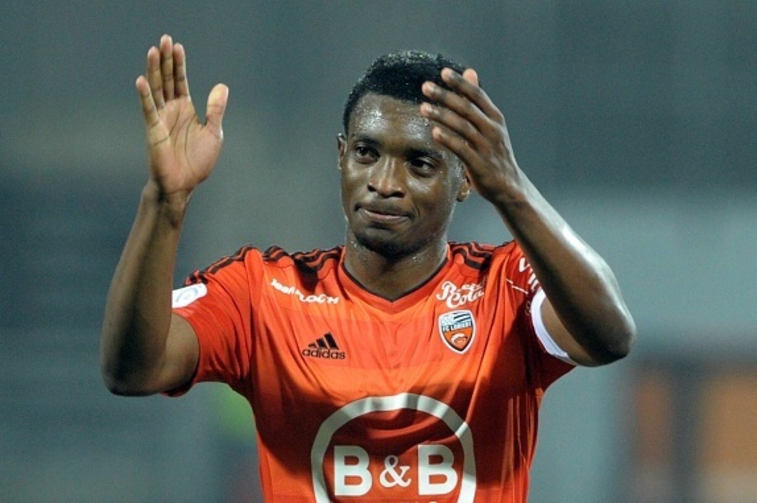 Lorient's Cameroonian forward Benjamin Moukandjo reacts after Lorient won the French L1 football match Lorient vs Troyes on November 7, 2015 in Lorient, western France. AFP PHOTO / FRED TANNEAU        (Photo credit should read FRED TANNEAU/AFP/Getty Image
