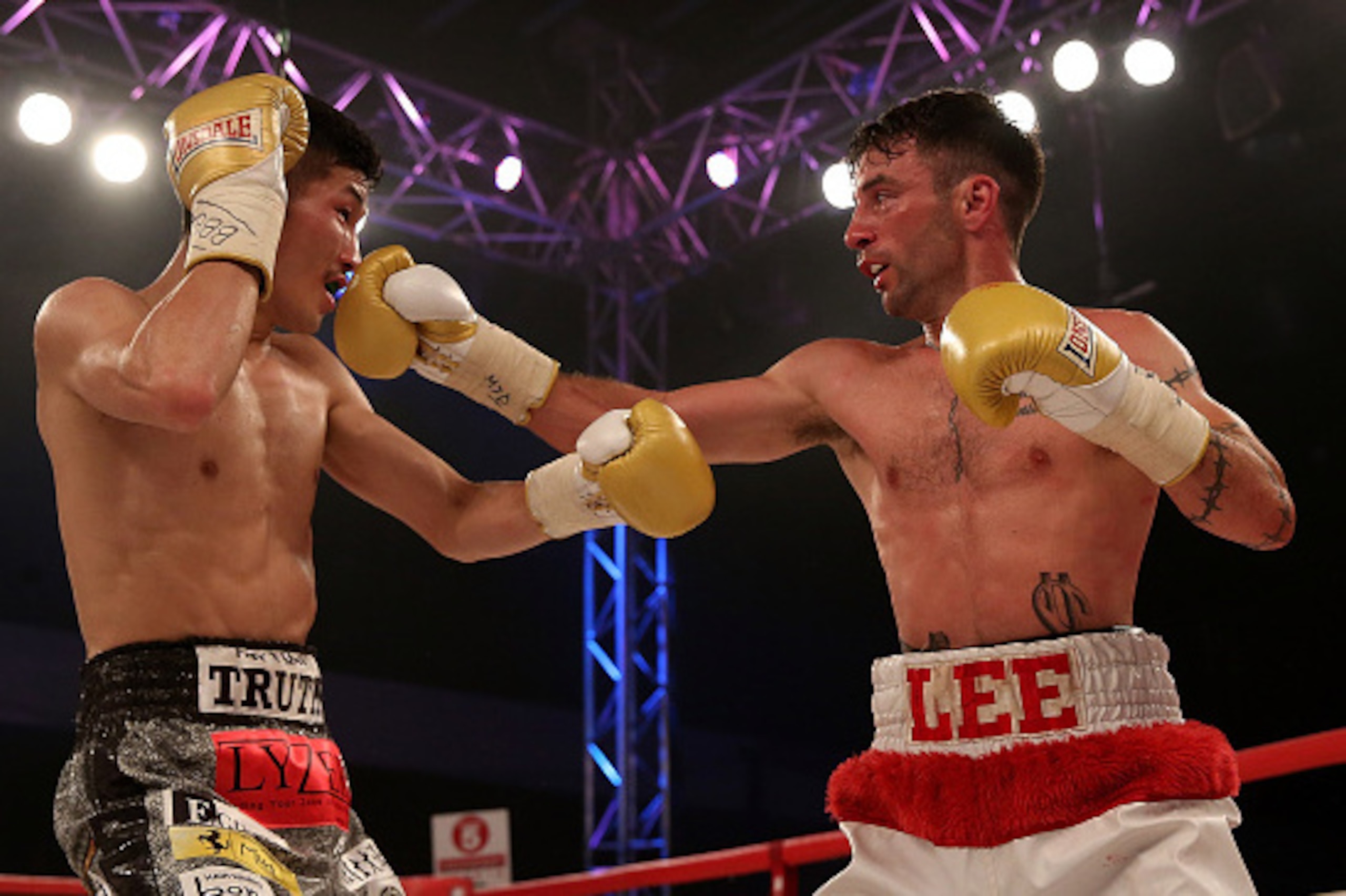BRISTOL, ENGLAND - JUNE 13: Lee Haskins of Great Britain and Ryosuke Iwasa of Japan exchange blows during their Interim IBF World Bantamweight Title Fight at Action Indoor Sports Arena on June 13, 2015 in Bristol, England. (Photo by Ben Hoskins/Getty Im BRISTOL, ENGLAND - JUNE 13: Lee Haskins of Great Britain and Ryosuke Iwasa of Japan exchange blows during their Interim IBF World Bantamweight Title Fight at Action Indoor Sports Arena on June 13, 2015 in Bristol, England. (Photo by Ben Hoskins/Getty Im