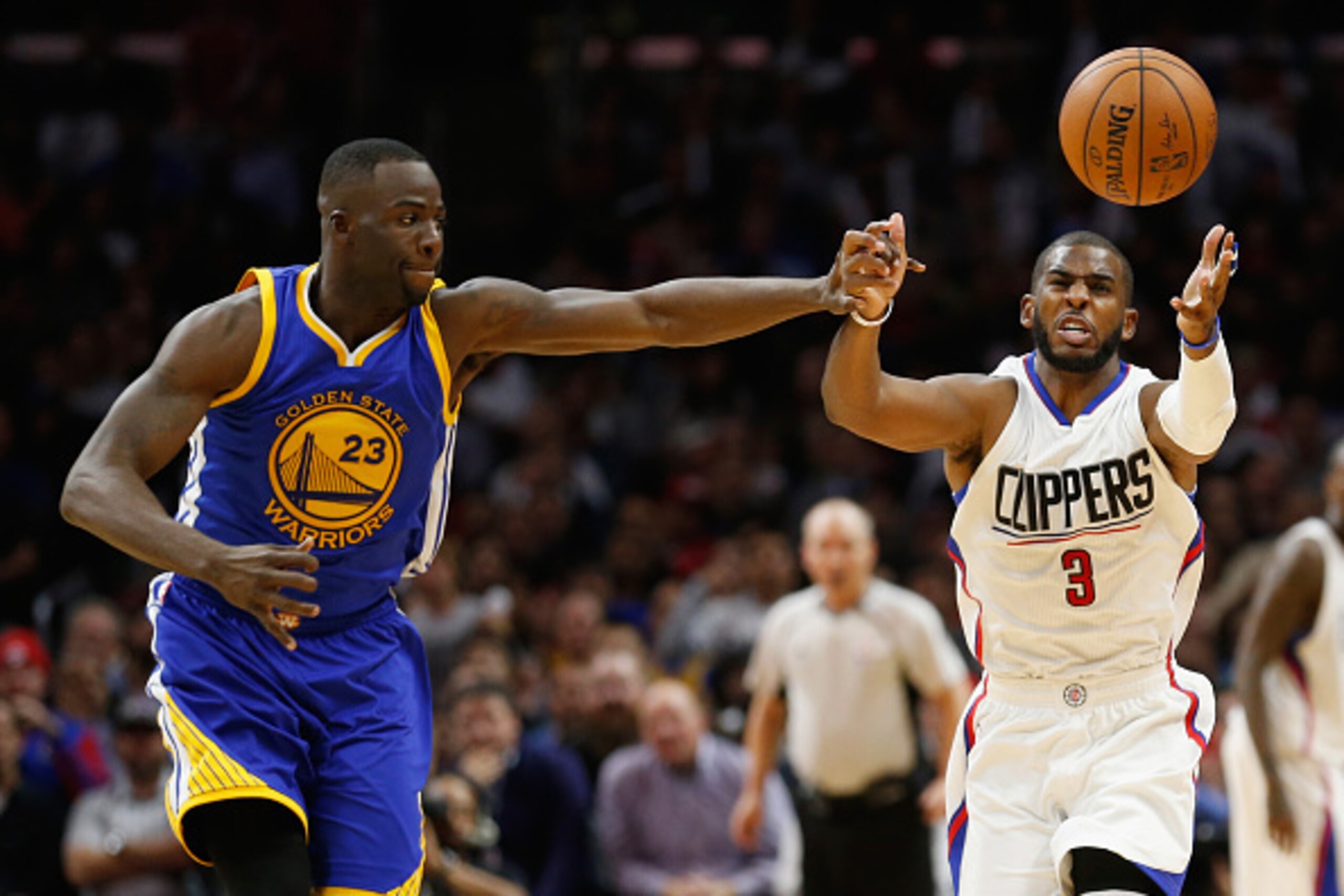 LOS ANGELES, CA - NOVEMBER 19:  Draymond Green #23 of the Golden State Warriors battles Chris Paul #3 of the Los Angeles Clippers for a loose ball during the second half of a game at Staples Center on November 19, 2015 in Los Angeles, California. NOTE TO 