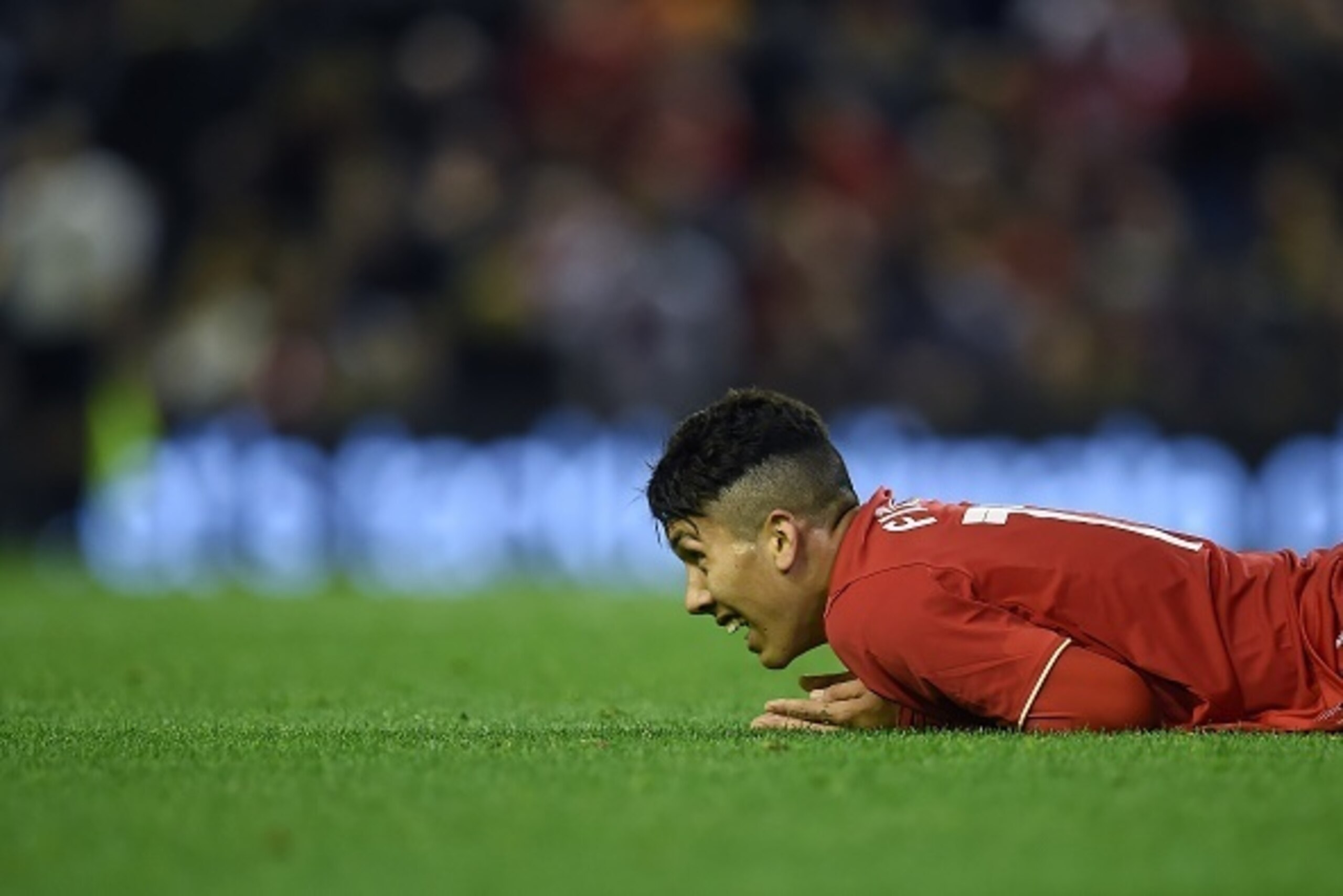 Liverpool's Brazilian midfielder Roberto Firmino reacts after having his shot on goal saved during the English League Cup fourth round football match between Liverpool and Bournemouth at Anfield stadium in Liverpool, north west England on October 28, 2015