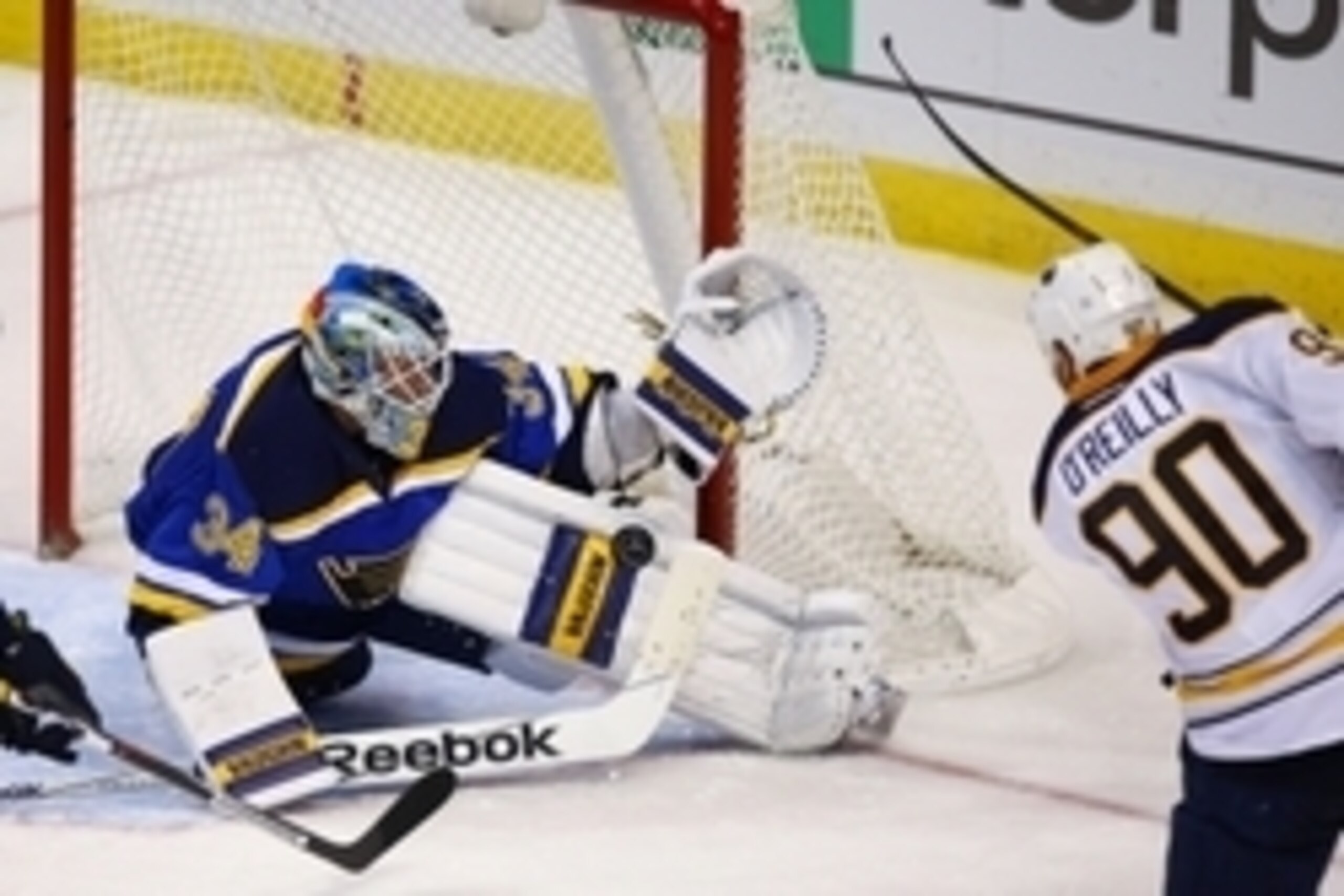 Nov 19, 2015; St. Louis, MO, USA; St. Louis Blues goalie Jake Allen (34) makes a save on a shot by Buffalo Sabres center Ryan O'Reilly (90) during the third period at Scottrade Center. The Blues won the game 3-2 in a shootout. Mandatory Credit: Billy Hurs