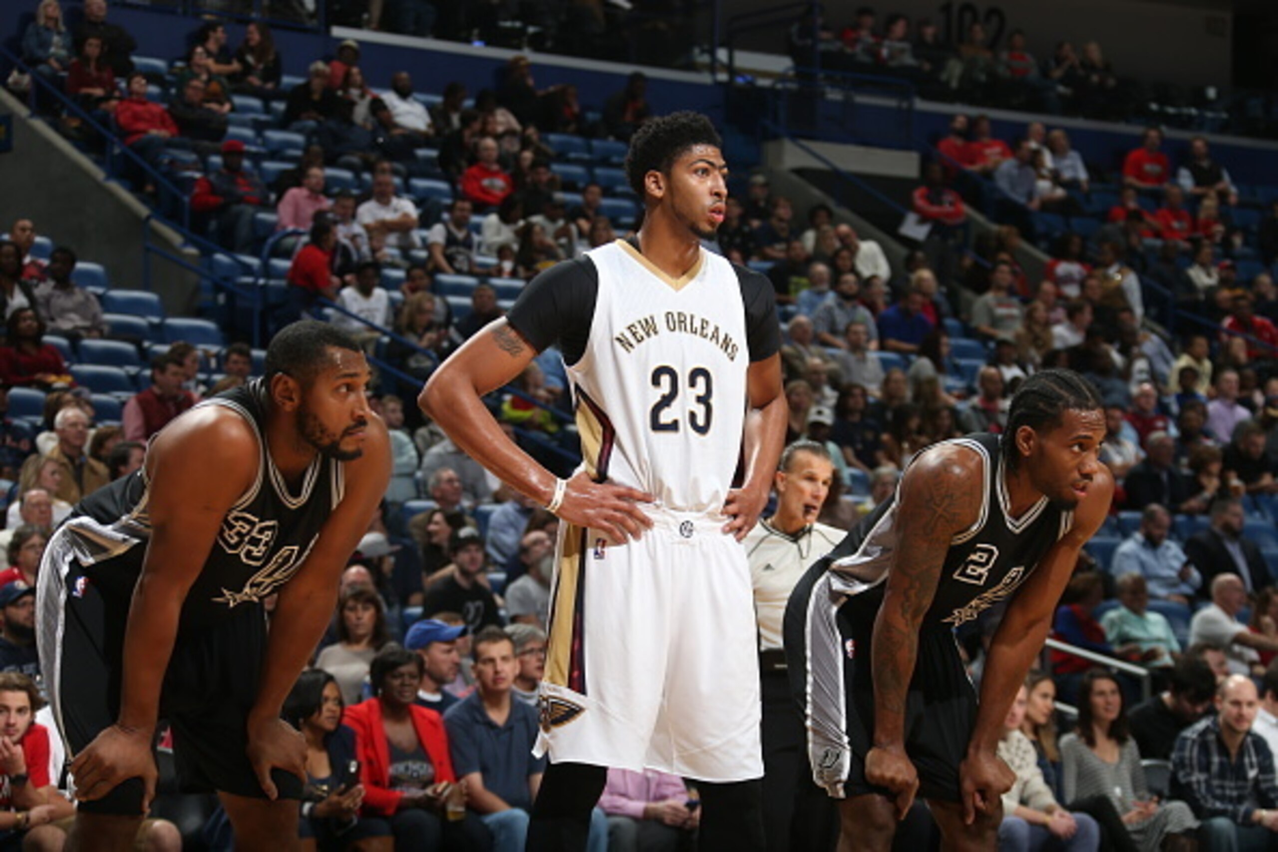 NEW ORLEANS, LA - NOVEMBER 20:  Anthony Davis #23 of the New Orleans Pelicans looks on with Boris Diaw #33 of the San Antonio Spurs and Kawhi Leonard #2 of the San Antonio Spurs on November 20, 2015 at the Smoothie King Center in New Orleans, Louisiana. N