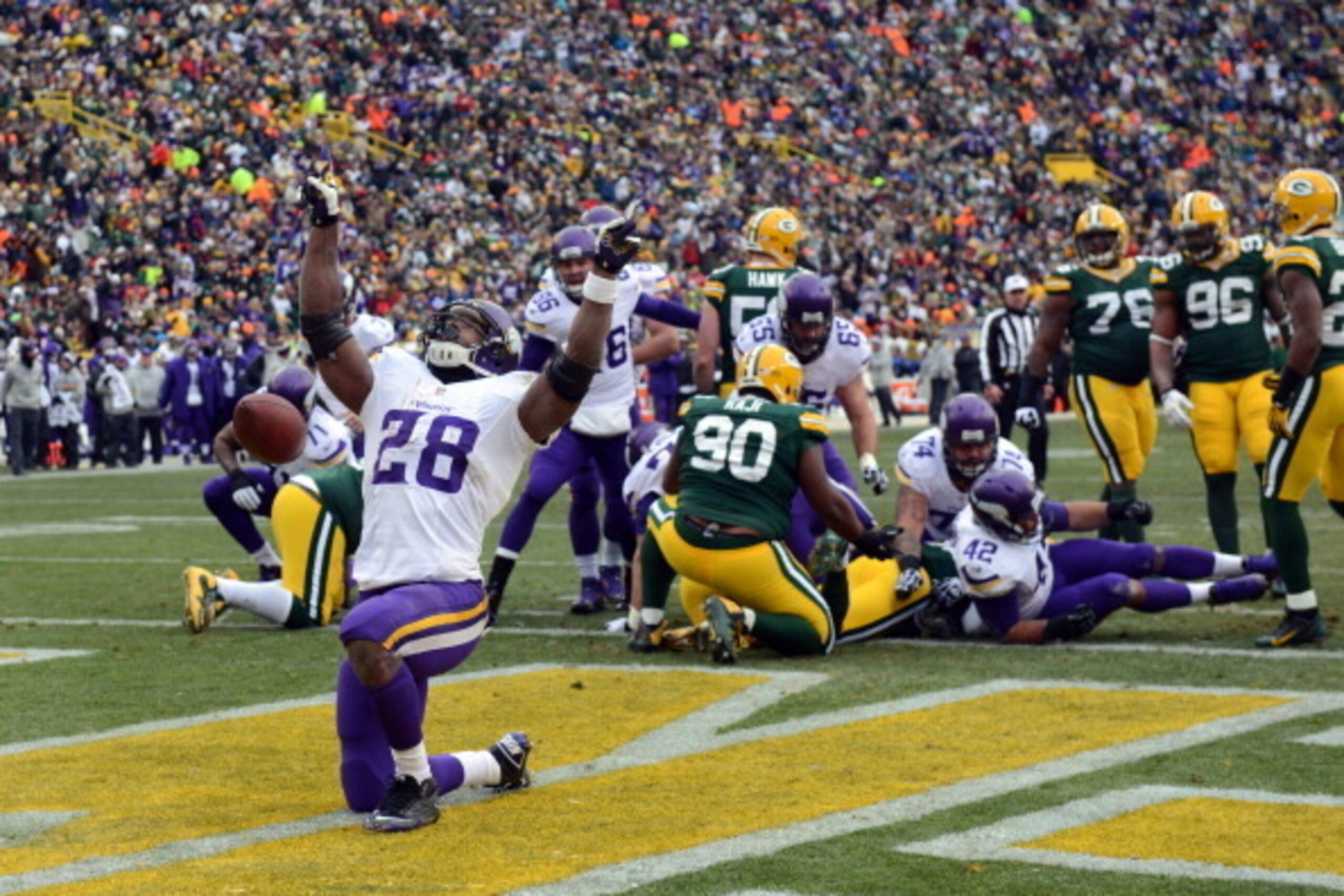 GREEN BAY - NOVEMBER 24: Adrian Peterson #28 of the Minnesota Vikings carries the ball for a touchdown during an NFL game against the Green Bay Packers at Lambeau Field, November 24, 2013 in Green Bay, Wisconsin. (Photo by Tom Dahlin/Getty Images) GREEN BAY - NOVEMBER 24: Adrian Peterson #28 of the Minnesota Vikings carries the ball for a touchdown during an NFL game against the Green Bay Packers at Lambeau Field, November 24, 2013 in Green Bay, Wisconsin. (Photo by Tom Dahlin/Getty Images)