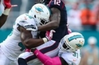 Oct 25, 2015; Miami Gardens, FL, USA; Miami Dolphins safety Michael Thomas (31) and linebacker Neville Hewitt (46) tackles Houston Texans wide receiver Keith Mumphery (12) during the second  half at Sun Life Stadium. The Dolphins won 44-26. Mandatory Cred