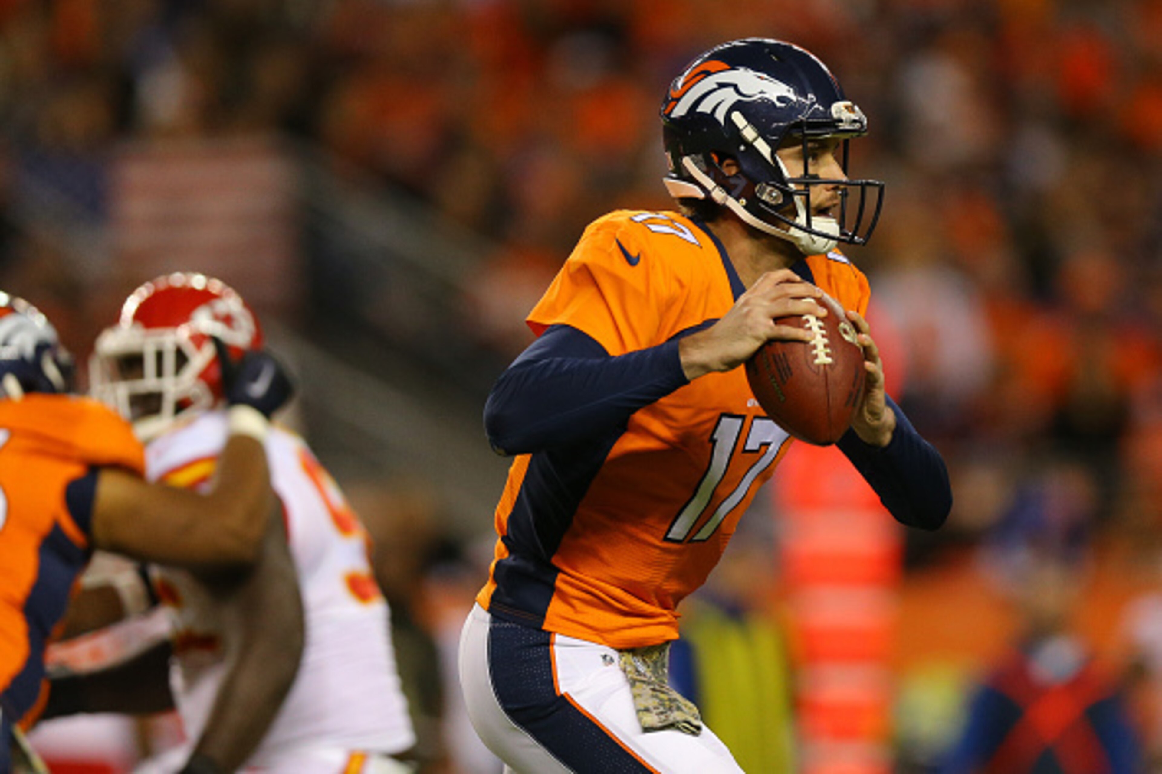 DENVER, CO - NOVEMBER 15:  Quarterback Brock Osweiler #17 of the Denver Broncos runs with the football during the third quarter against the Kansas City Chiefs at Sports Authority Field Field at Mile High on November 15, 2015 in Denver, Colorado. The Chief