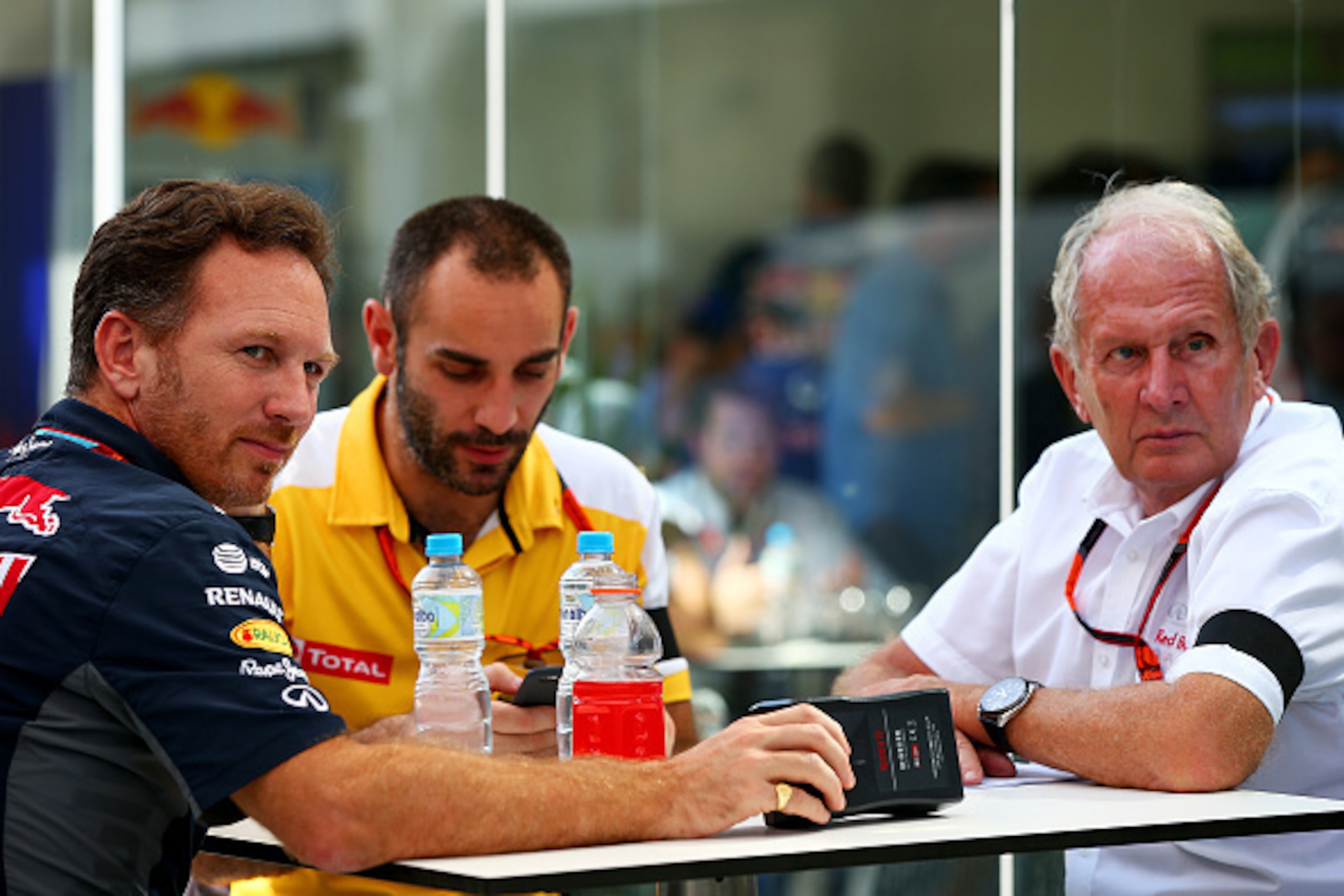SAO PAULO, BRAZIL - NOVEMBER 14:  Infiniti Red Bull Racing Team Principal Christian Horner speaks with Infiniti Red Bull Racing Team Consultant Dr Helmut Marko and  Renault's Cyril Abiteboul after qualifying for the Formula One Grand Prix of Brazil at Aut