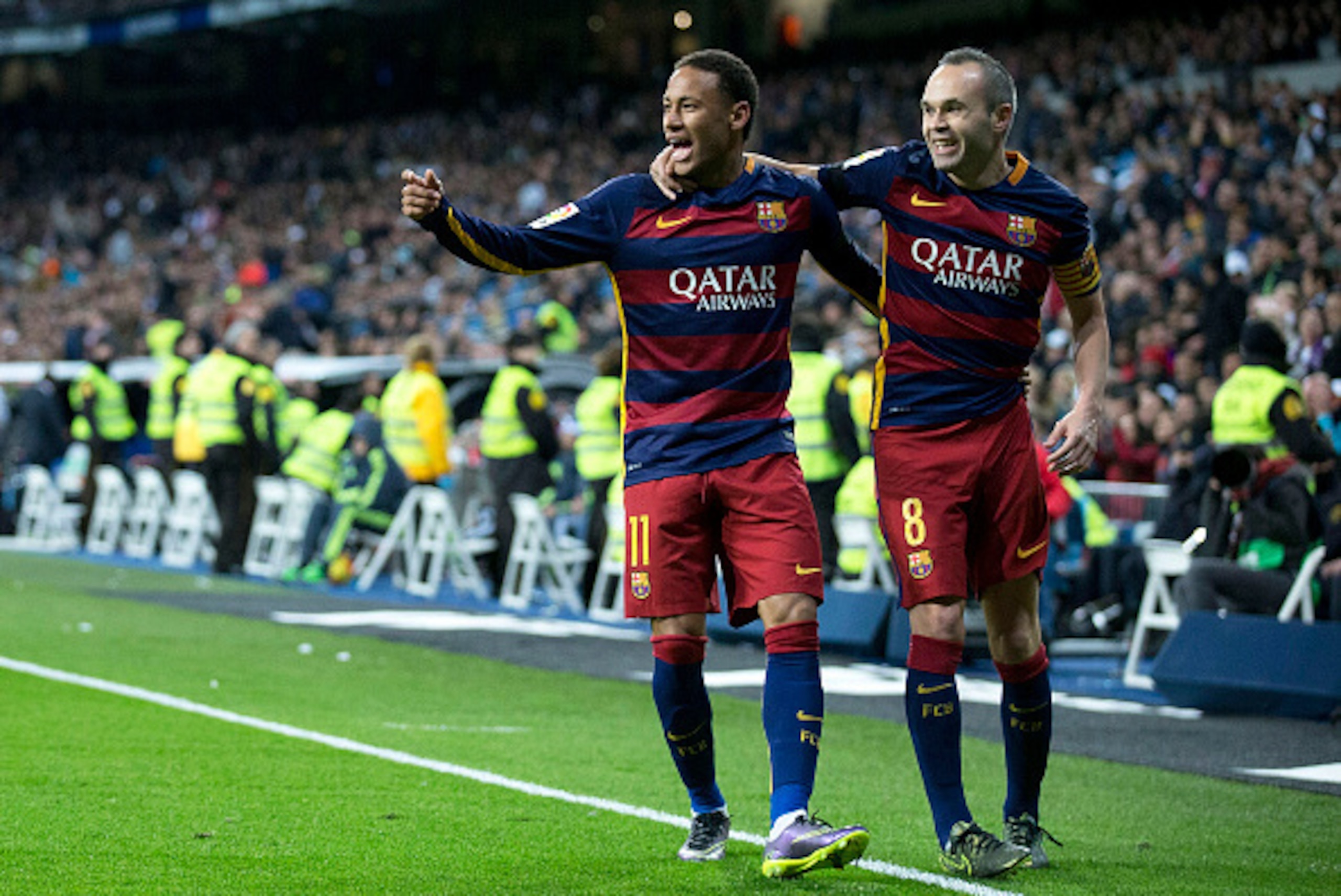 MADRID, SPAIN - NOVEMBER 21: Neymar JR. (L) of FC Barcelona celebrates scoring their second goal with teammate Andres Iniesta (R) during the La Liga match between Real Madrid CF and FC Barcelona at Estadio Santiago Bernabeu on November 21, 2015 in Madrid MADRID, SPAIN - NOVEMBER 21: Neymar JR. (L) of FC Barcelona celebrates scoring their second goal with teammate Andres Iniesta (R) during the La Liga match between Real Madrid CF and FC Barcelona at Estadio Santiago Bernabeu on November 21, 2015 in Madrid