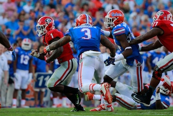 Oct 31, 2015; Jacksonville, FL, USA; Georgia Bulldogs running back Sony Michel (1) runs with the ball as Florida Gators linebacker Antonio Morrison (3) defends during the second half at EverBank Stadium. Florida Gators defeated the Georgia Bulldogs 27-3. Oct 31, 2015; Jacksonville, FL, USA; Georgia Bulldogs running back Sony Michel (1) runs with the ball as Florida Gators linebacker Antonio Morrison (3) defends during the second half at EverBank Stadium. Florida Gators defeated the Georgia Bulldogs 27-3.