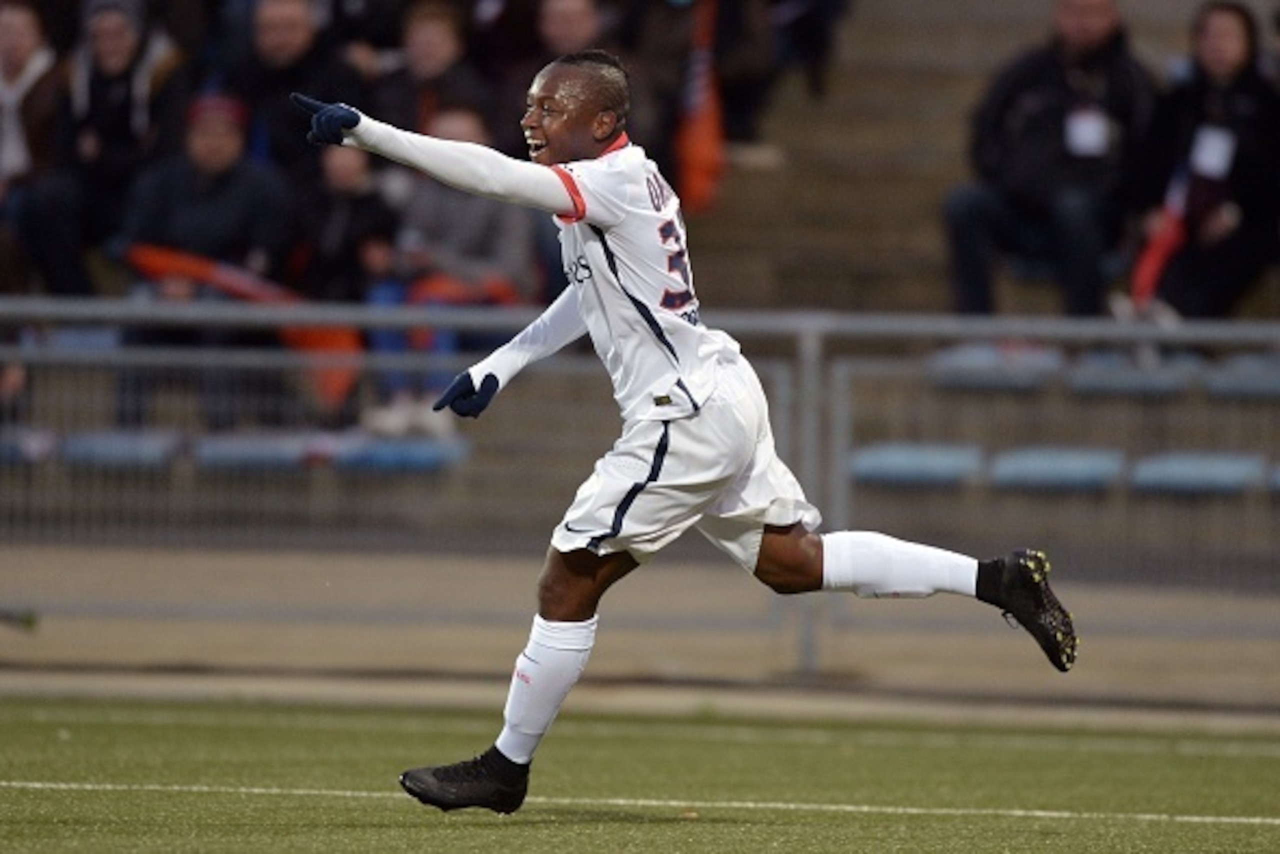 Paris Saint-Germain's French forward Hervin Ongenda celebrates after scoring a goal during the French L1 football match between Lorient and Paris Saint-Germain on November 21, 2015 at the Moustoir stadium in Lorient, western France. AFP PHOTO / JEAN-SEBAS Paris Saint-Germain's French forward Hervin Ongenda celebrates after scoring a goal during the French L1 football match between Lorient and Paris Saint-Germain on November 21, 2015 at the Moustoir stadium in Lorient, western France. AFP PHOTO / JEAN-SEBAS