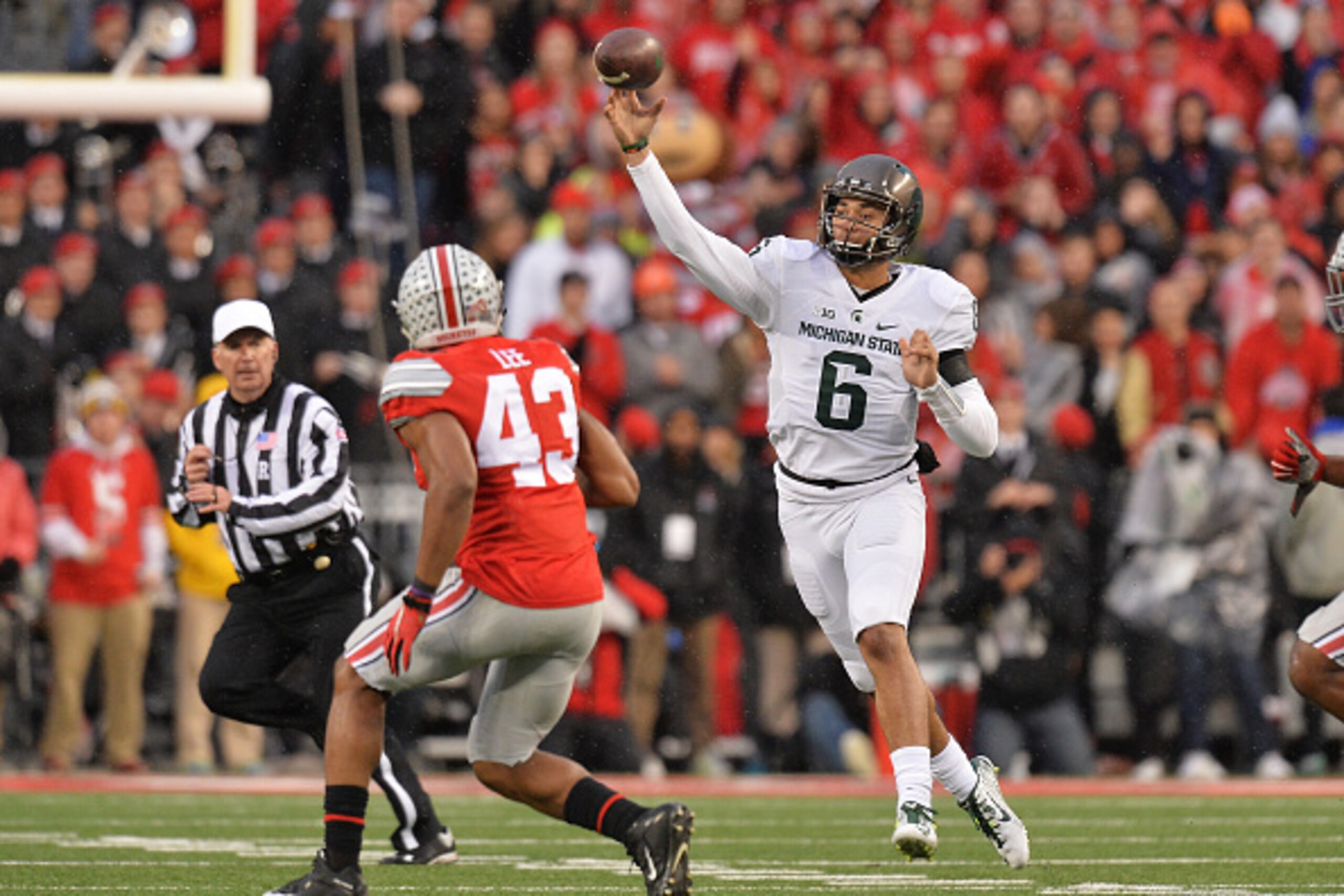COLUMBUS, OH - NOVEMBER 21:  Damion Terry #6 of the Michigan State Spartans completes a pass in the first quarter against the Ohio State Buckeyes at Ohio Stadium on November 21, 2015 in Columbus, Ohio.  (Photo by Jamie Sabau/Getty Images)