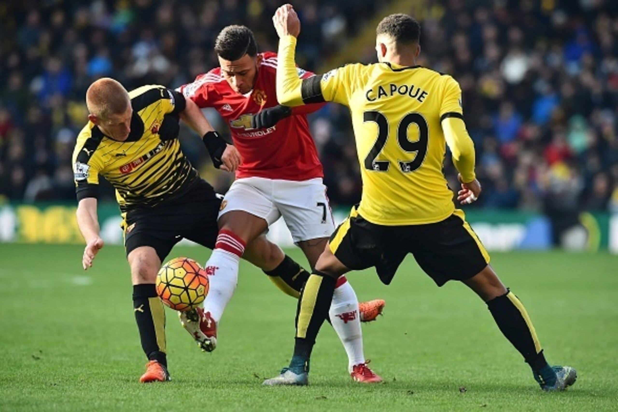 Manchester United's Dutch midfielder Memphis Depay vies with Watford's English midfielder Ben Watson (L) and Watford's French midfielder Etienne Capoue (R) during the English Premier League football match between Watford and Manchester United at Vicarage Manchester United's Dutch midfielder Memphis Depay vies with Watford's English midfielder Ben Watson (L) and Watford's French midfielder Etienne Capoue (R) during the English Premier League football match between Watford and Manchester United at Vicarage