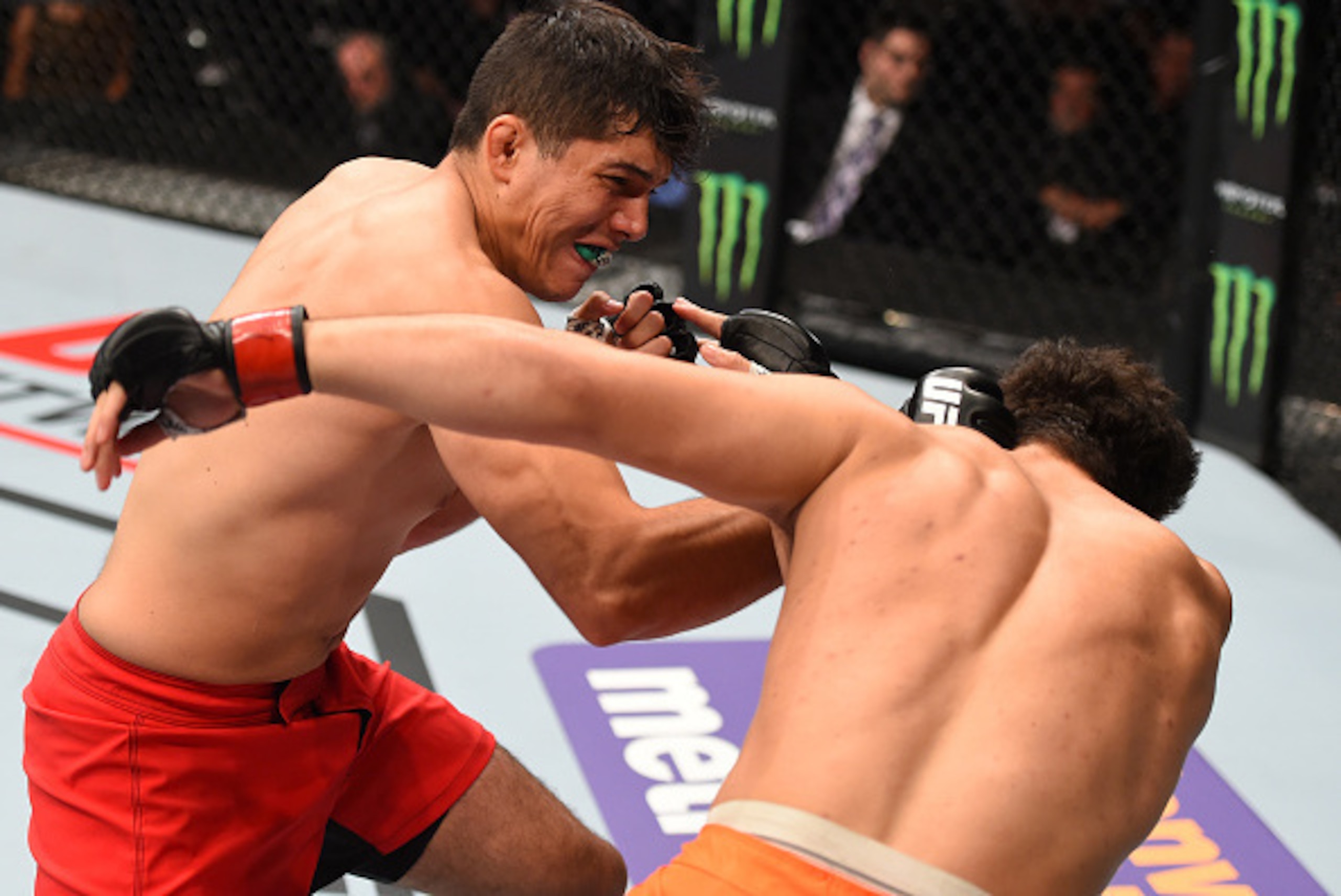 MONTERREY, MEXICO - NOVEMBER 21:  (L-R) Alvaro Herrera of Mexico knocks out Vernon Ramos of Panama in their welterweight bout during the UFC Fight Night event at Arena Monterrey on November 21, 2015 in Monterrey, Mexico.  (Photo by Jeff Bottari/Zuffa LLC/