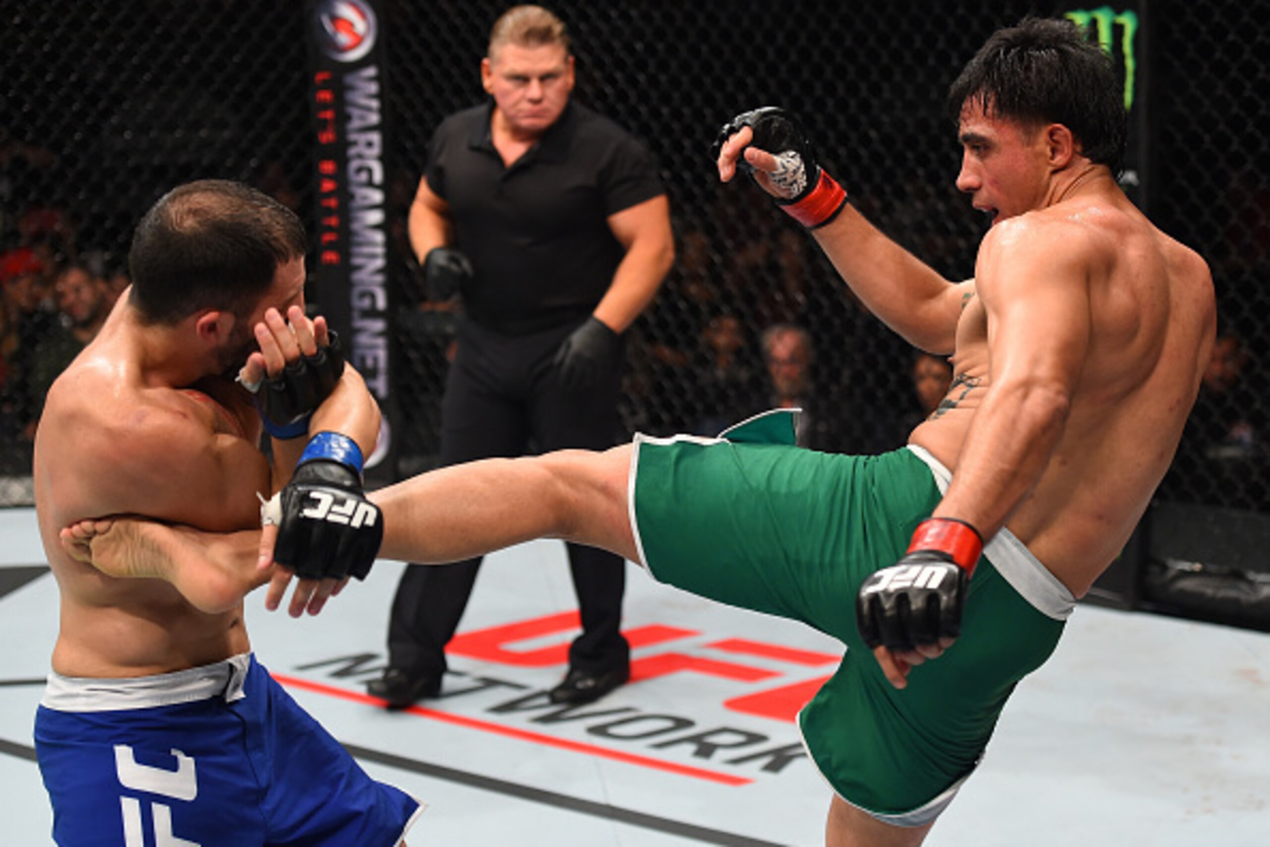 MONTERREY, MEXICO - NOVEMBER 21:  (R-L) Erick Montano of Mexico kicks Enrique Marin of Spain in their welterweight bout during the UFC Fight Night event at Arena Monterrey on November 21, 2015 in Monterrey, Mexico.  (Photo by Jeff Bottari/Zuffa LLC/Zuffa 
