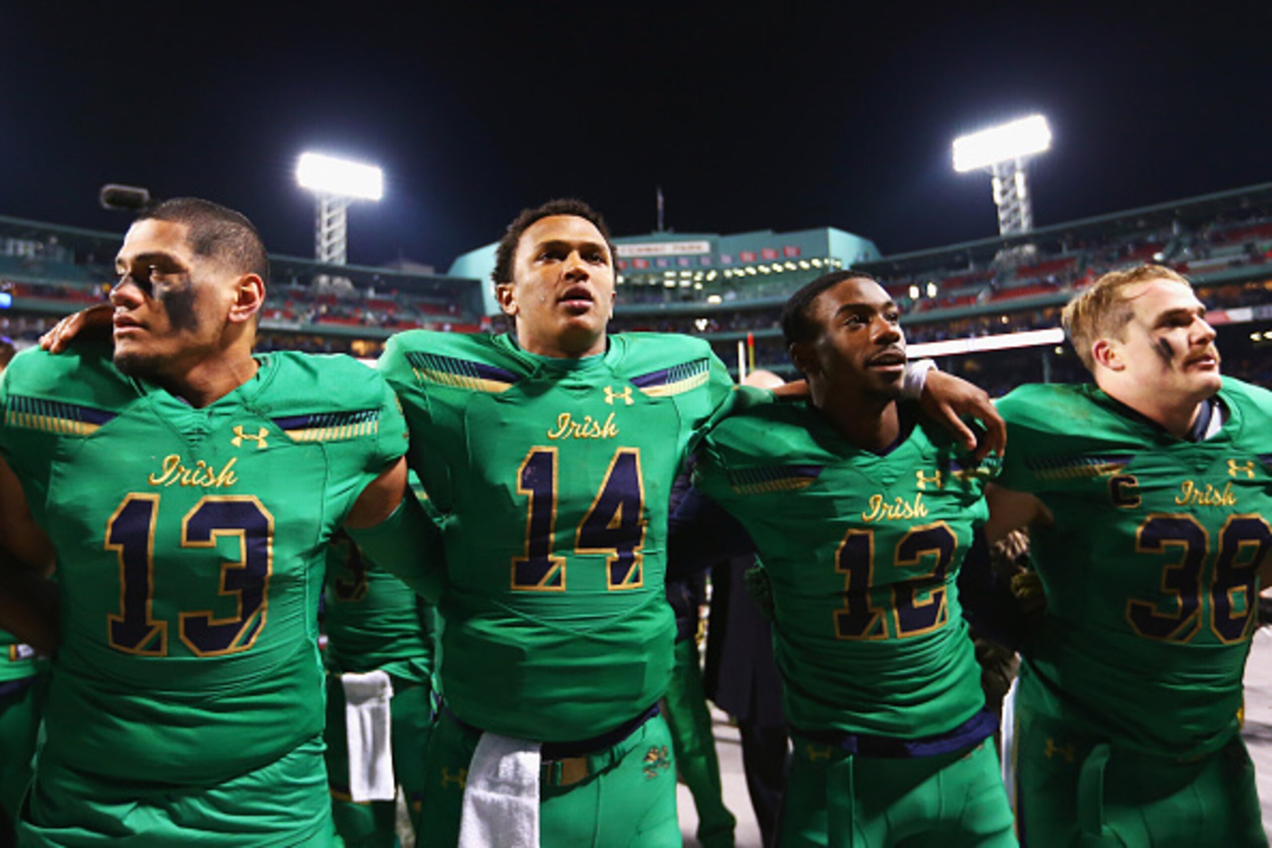 BOSTON, MA - NOVEMBER 21: Tyler Luatua #13 of the Notre Dame Fighting Irish, DeShone Kizer #14, Devin Butler #12 and Joe Schmidt #38 sing the Notre Dame Alma Mater after the game against the Boston College Eagles at Fenway Park on November 21, 2015 in Bo BOSTON, MA - NOVEMBER 21: Tyler Luatua #13 of the Notre Dame Fighting Irish, DeShone Kizer #14, Devin Butler #12 and Joe Schmidt #38 sing the Notre Dame Alma Mater after the game against the Boston College Eagles at Fenway Park on November 21, 2015 in Bo