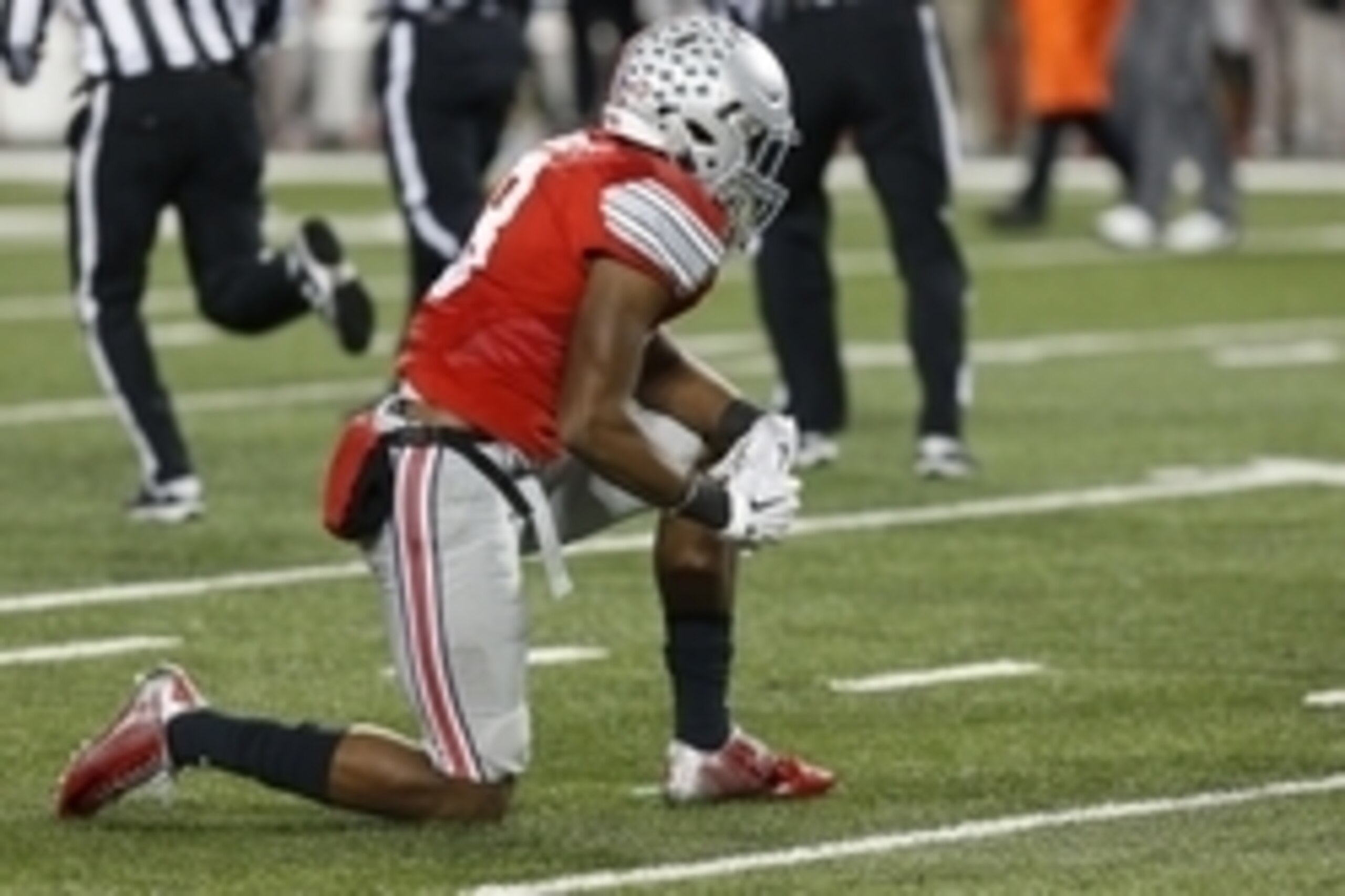 Nov 21, 2015; Columbus, OH, USA; Ohio State Buckeyes cornerback Gareon Conley (8) kneels on the field after the Buckeyes' game against the Michigan State Spartans at Ohio Stadium. The Spartans won 17-14. Mandatory Credit: Geoff Burke-USA TODAY Sports