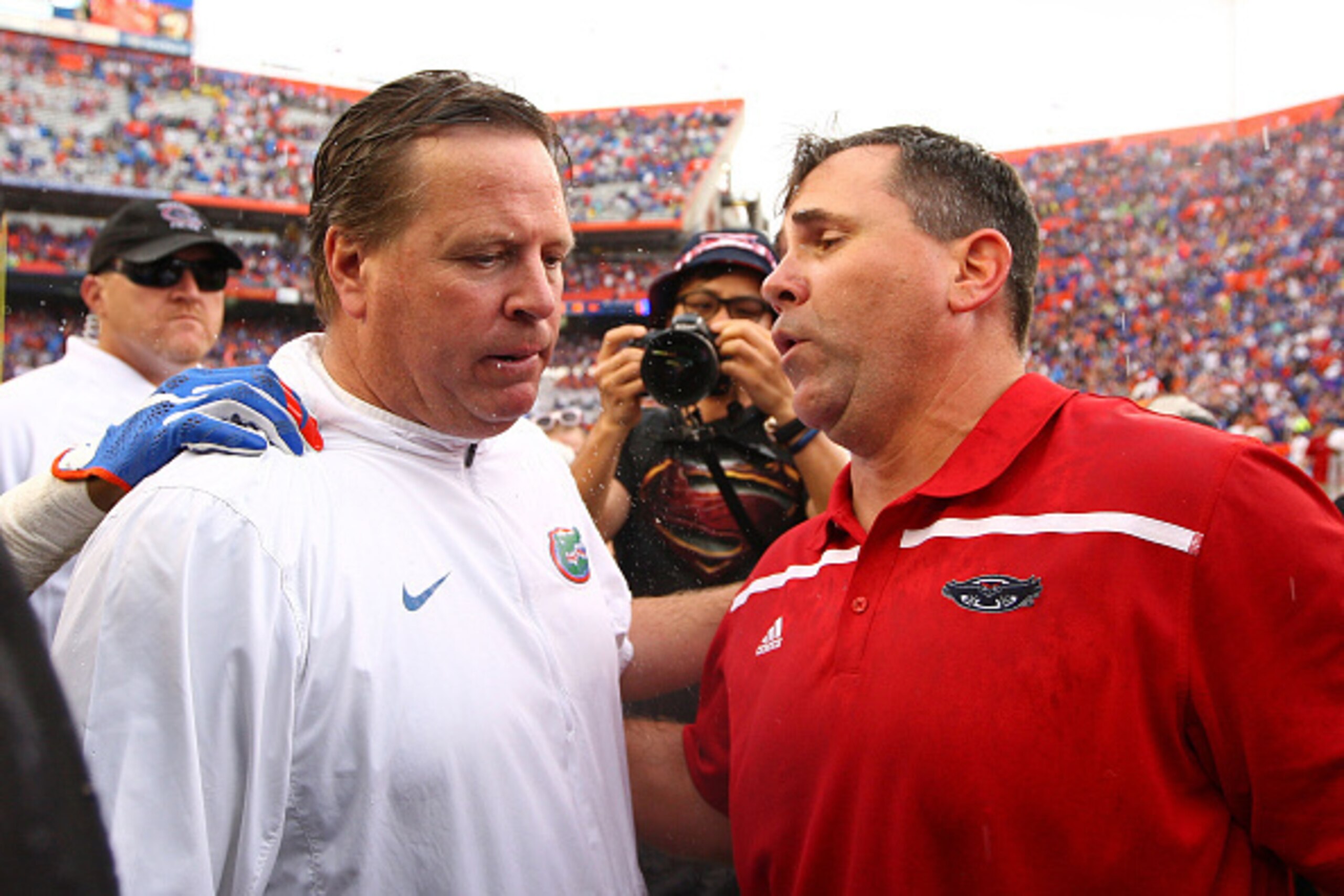 GAINESVILLE, FL - NOVEMBER 21: Head coaches Jim McElwain of the Florida Gators and Charlie Partridge of the Florida Atlantic Owls shake hands after the game at Ben Hill Griffin Stadium on November 21, 2015 in Gainesville, Florida.  (Photo by Rob Foldy/Get