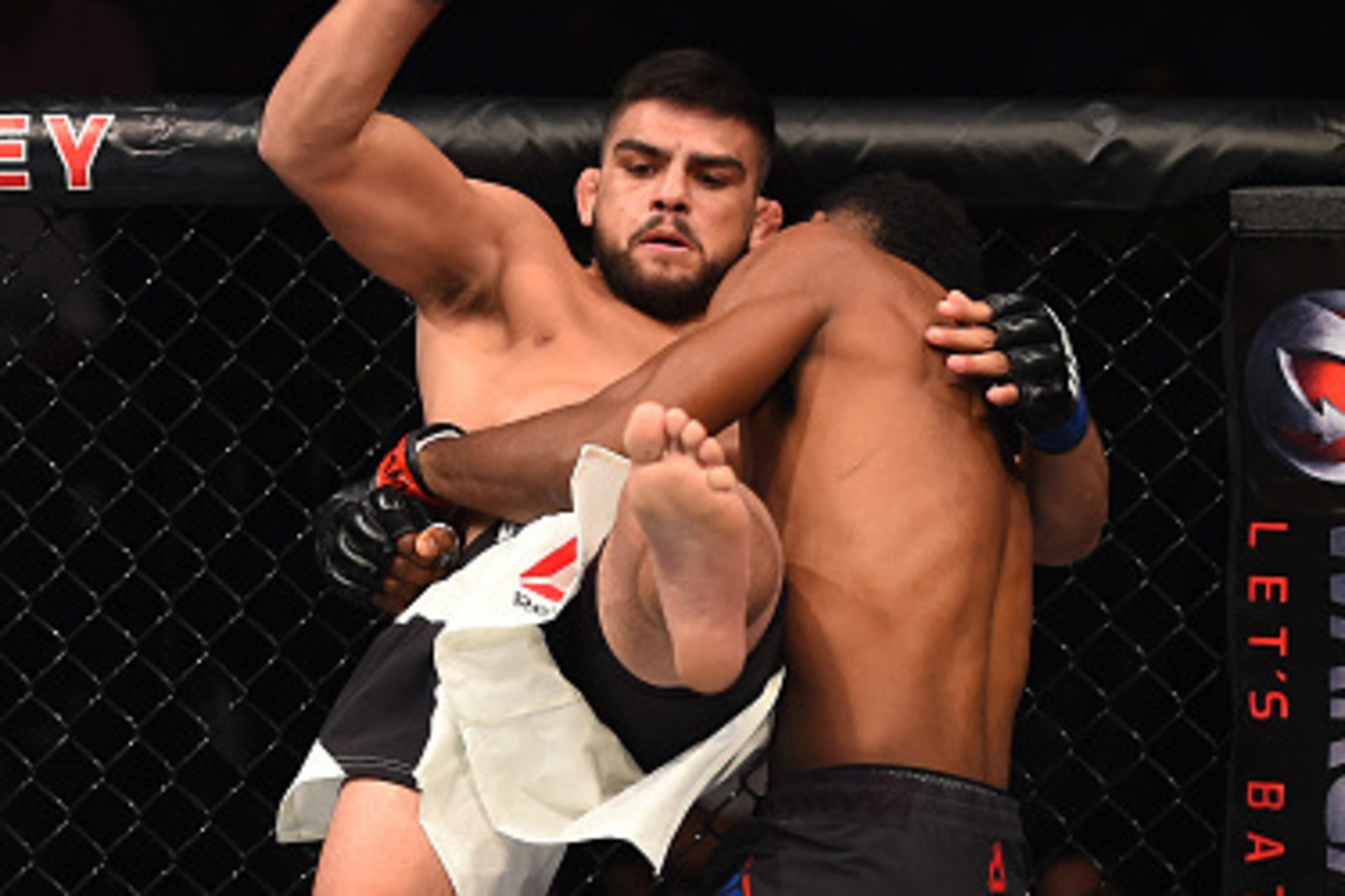 MONTERREY, MEXICO - NOVEMBER 21:  (R-L) Neil Magny of the United States takes down Kelvin Gastelum of the United States in their welterweight bout during the UFC Fight Night event at Arena Monterrey on November 21, 2015 in Monterrey, Mexico.  (Photo by Je