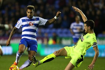 READING, ENGLAND - NOVEMBER 03:  Danny Williams of Reading is tackled by Mark Hudson of Huddersfield during the Sky Bet Championship match between Reading and Huddersfield Town on November 3, 2015 in Reading, United Kingdom.  (Photo by Ben Hoskins/Getty I