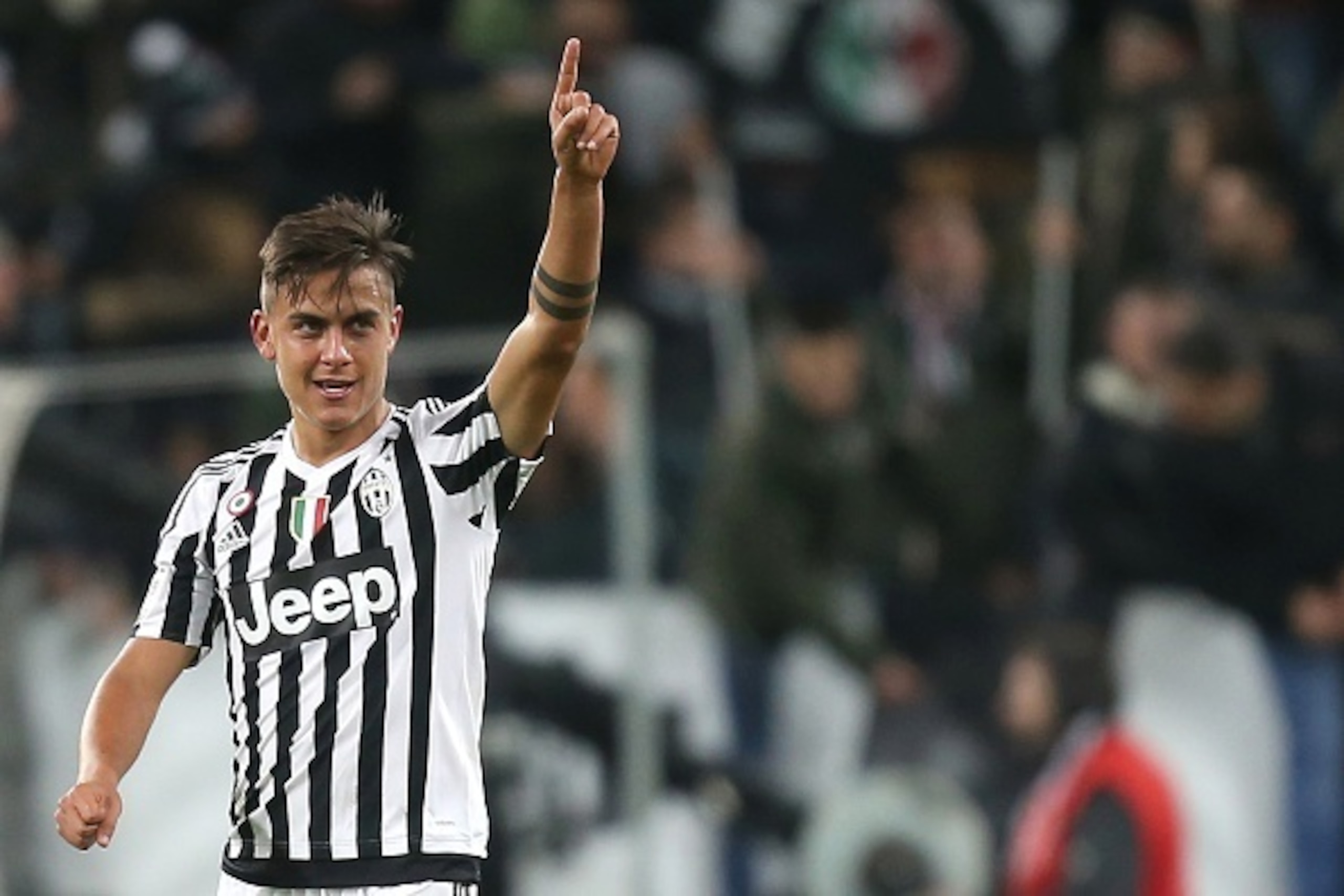 Juventus' Argentinianforward Paulo Dybala celebrates at the end of the Italian Serie A football match between Juventus and AC Milan on November 21, 2015 at the Juventus Stadium in Turin. AFP PHOTO / MARCO BERTORELLO        (Photo credit should read MARCO 
