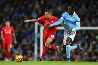 MANCHESTER, ENGLAND - NOVEMBER 21: Philippe Coutinho of Liverpool and Bacary Sagna of Manchester City compete for the ball during the Barclays Premier League match between Manchester City and Liverpool at Etihad Stadium on November 21, 2015 in Manchester,