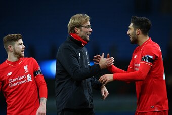 MANCHESTER, ENGLAND - NOVEMBER 21:  Jurgen Klopp (L), manager of Liverpool and Emre Can (R) celebrate their 4-1 win in the Barclays Premier League match between Manchester City and Liverpool at Etihad Stadium on November 21, 2015 in Manchester, England.