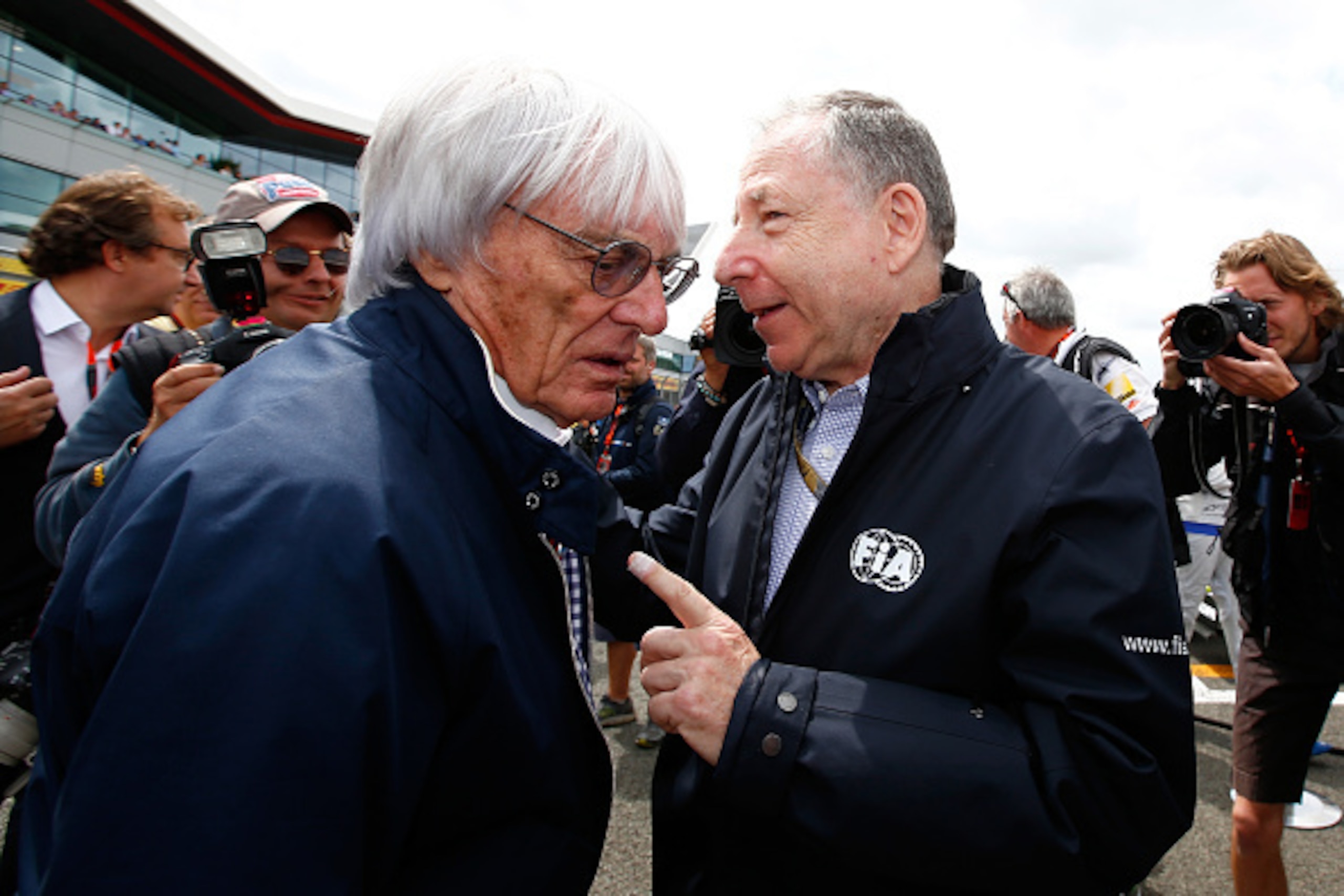 NORTHAMPTON, ENGLAND - JULY 05:  F1 supremo Bernie Ecclestone speaks with FIA President Jean Todt on the grid before the Formula One Grand Prix of Great Britain at Silverstone Circuit on July 5, 2015 in Northampton, England.  (Photo by Clive Rose/Getty Im