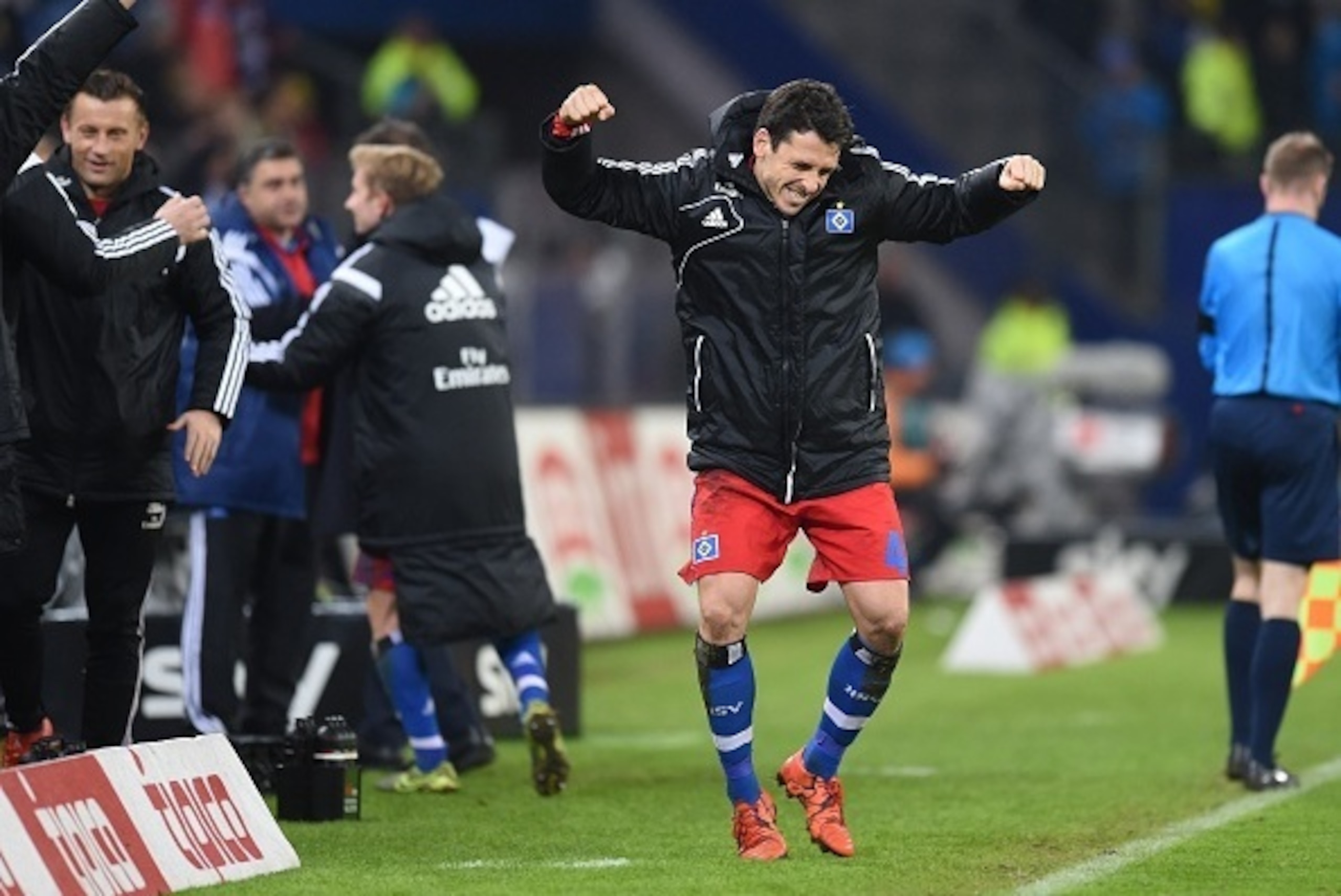 Hamburg's Bosnian defender Emir Spahic celebrates after the German first division football Bundesliga match between Hamburg SV and Borussia Dortmund in Hamburg, northern Germany on November 20, 2015. Hamburg won the match 3-1. AFP PHOTO / CARMEN JASPERSEN
