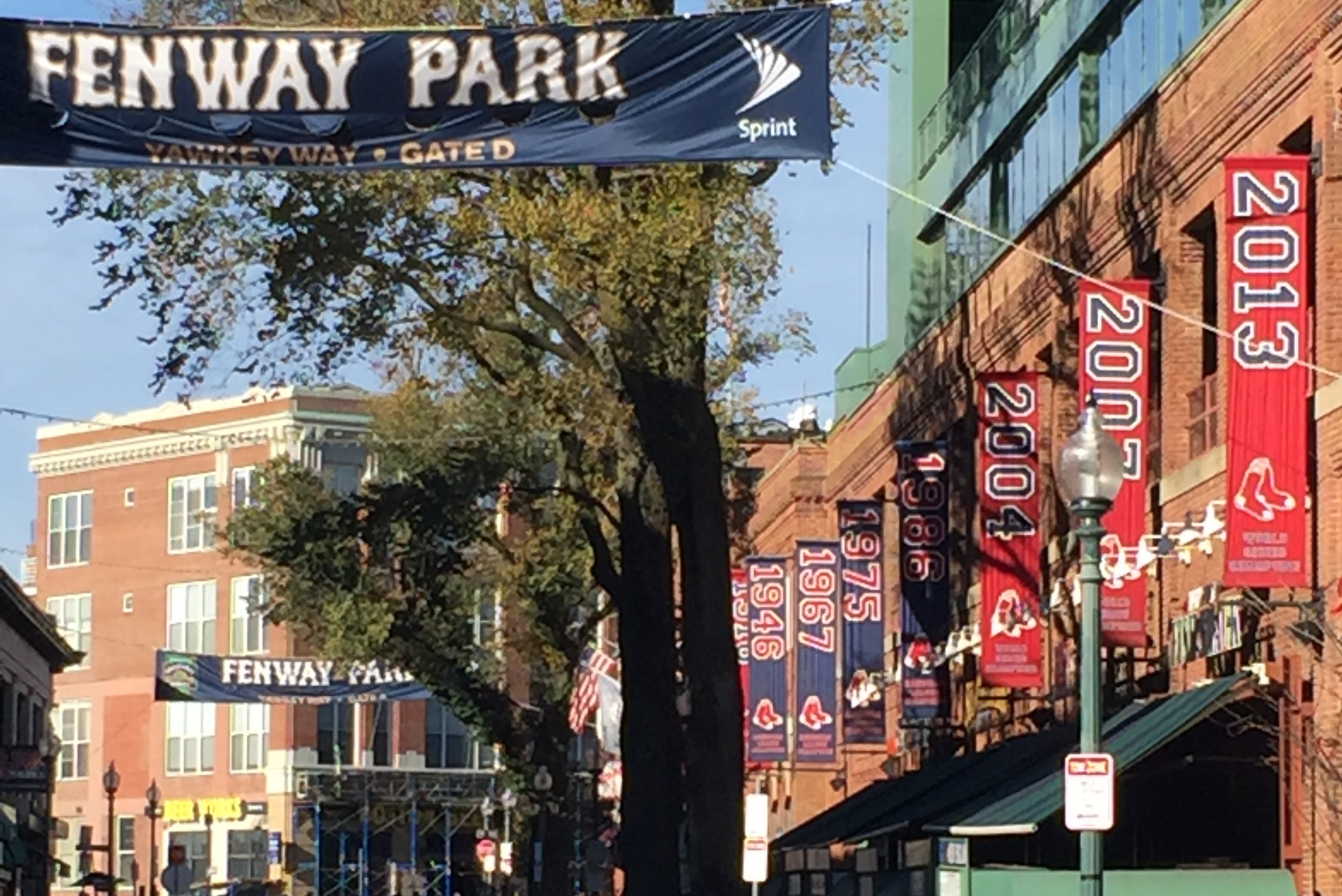Fans begin to trickle through Yawkey Way. Fans begin to trickle through Yawkey Way.