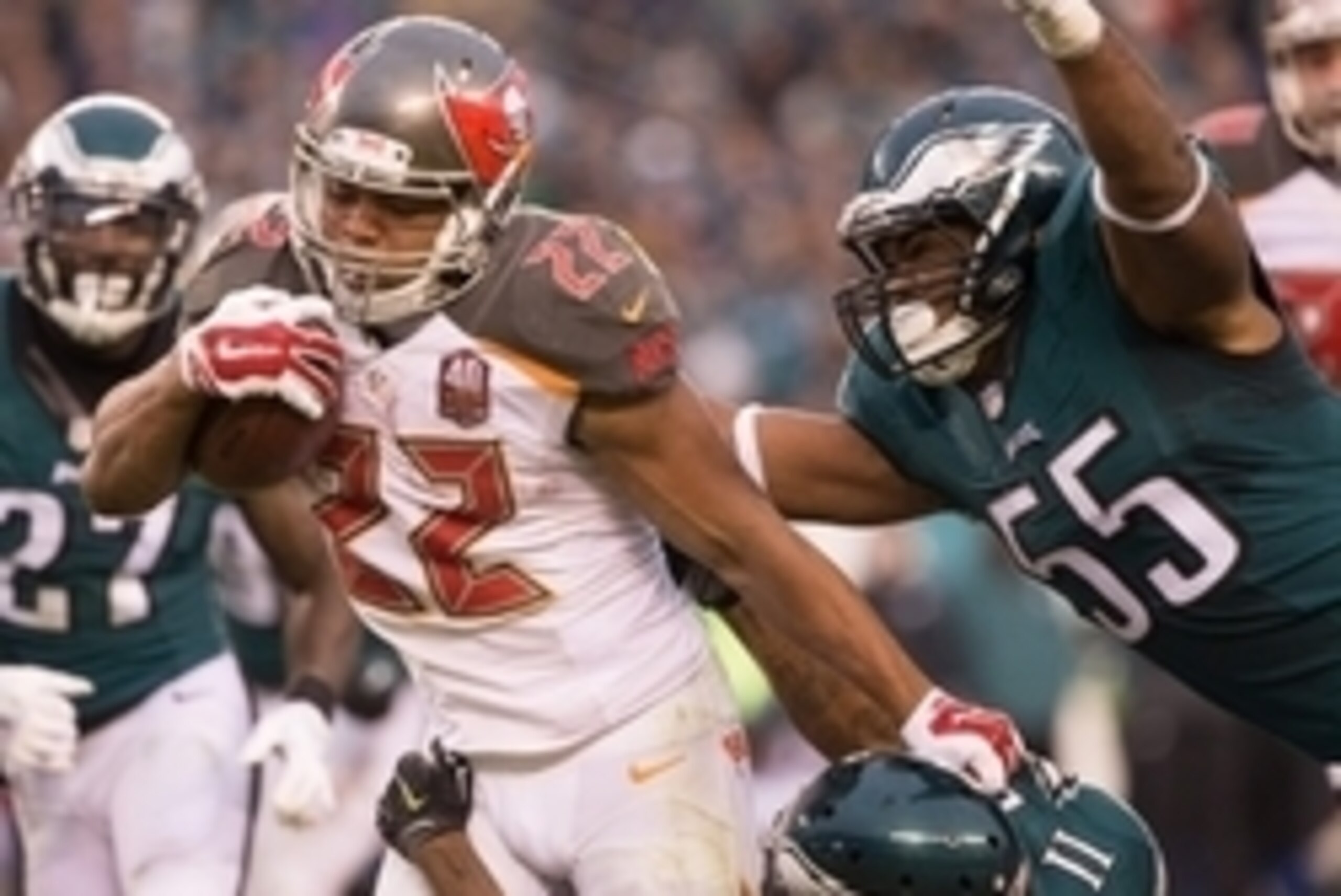 Nov 22, 2015; Philadelphia, PA, USA; Tampa Bay Buccaneers running back Doug Martin (22) runs with the ball as Philadelphia Eagles outside linebacker Brandon Graham (55) tackles from behind during the second half at Lincoln Financial Field. The Buccaneers 