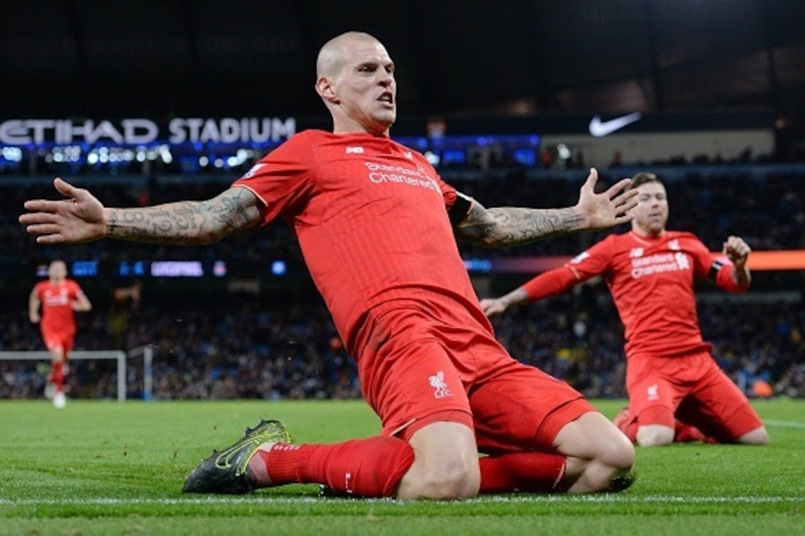 Liverpool's Slovakian defender Martin Skrtel (C) celebrates with teammates after scoring their fourth goal of the English Premier League football match between Manchester City and Liverpool at The Etihad stadium in Manchester, north west England on Novemb