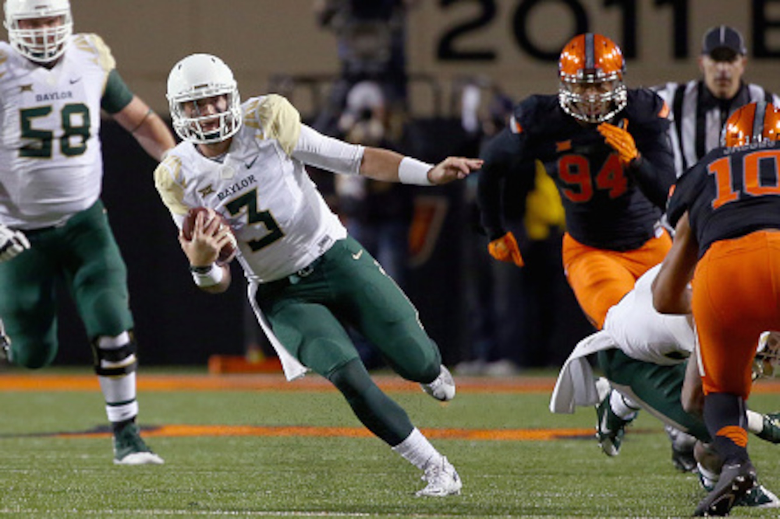 STILLWATER, OK - NOVEMBER 21: Jarrett Stidham #3 of the Baylor Bears scrambles with the ball against the Oklahoma State Cowboys in the second quarter at Boone Pickens Stadium on November 21, 2015 in Stillwater, Oklahoma. (Photo by Tom Pennington/Getty I STILLWATER, OK - NOVEMBER 21: Jarrett Stidham #3 of the Baylor Bears scrambles with the ball against the Oklahoma State Cowboys in the second quarter at Boone Pickens Stadium on November 21, 2015 in Stillwater, Oklahoma. (Photo by Tom Pennington/Getty I