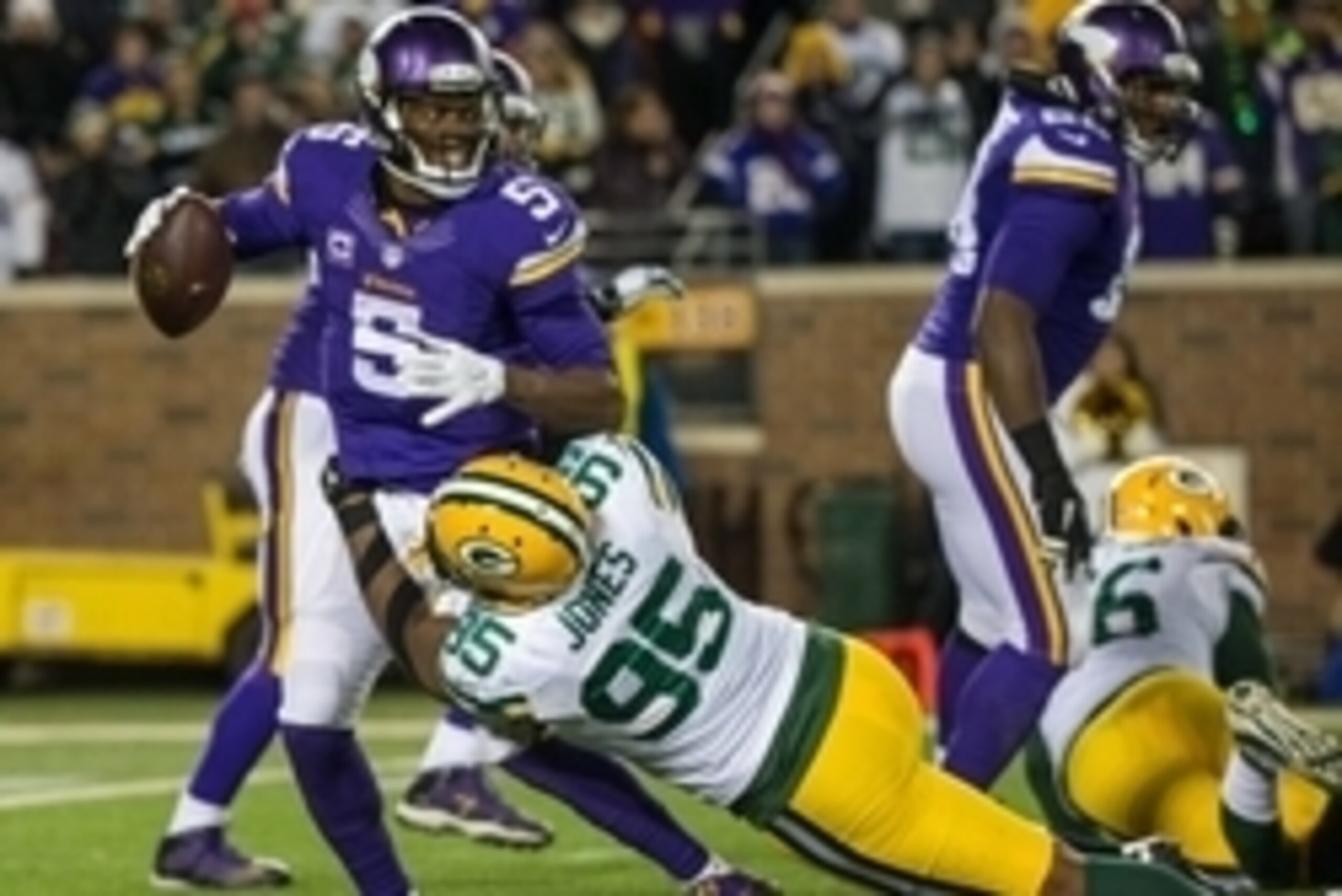 Nov 22, 2015; Minneapolis, MN, USA; Minnesota Vikings quarterback Teddy Bridgewater (5) is sacked by Green Bay Packers defensive end Datone Jones (95) during the third quarter at TCF Bank Stadium. The Packers defeated the Vikings 30-15. Mandatory Credit: