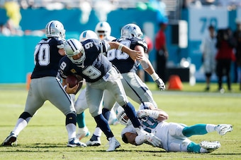 MIAMI GARDENS, FL - NOVEMBER 22: Olivier Vernon #50 of the Miami Dolphins sacks Tony Romo #9 of the Dallas Cowboys in the second quarter of the game at Sun Life Stadium on November 22, 2015 in Miami Gardens, Florida. (Photo by Joe Robbins/Getty Images)